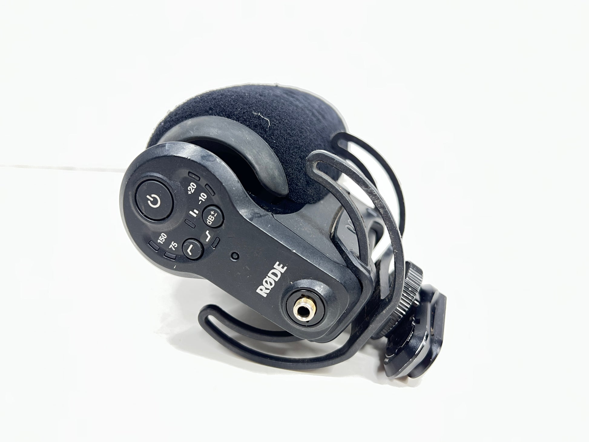 Used Rode VideoMic Pro shotgun microphone with damaged foam windscreen and visible onboard audio controls.
