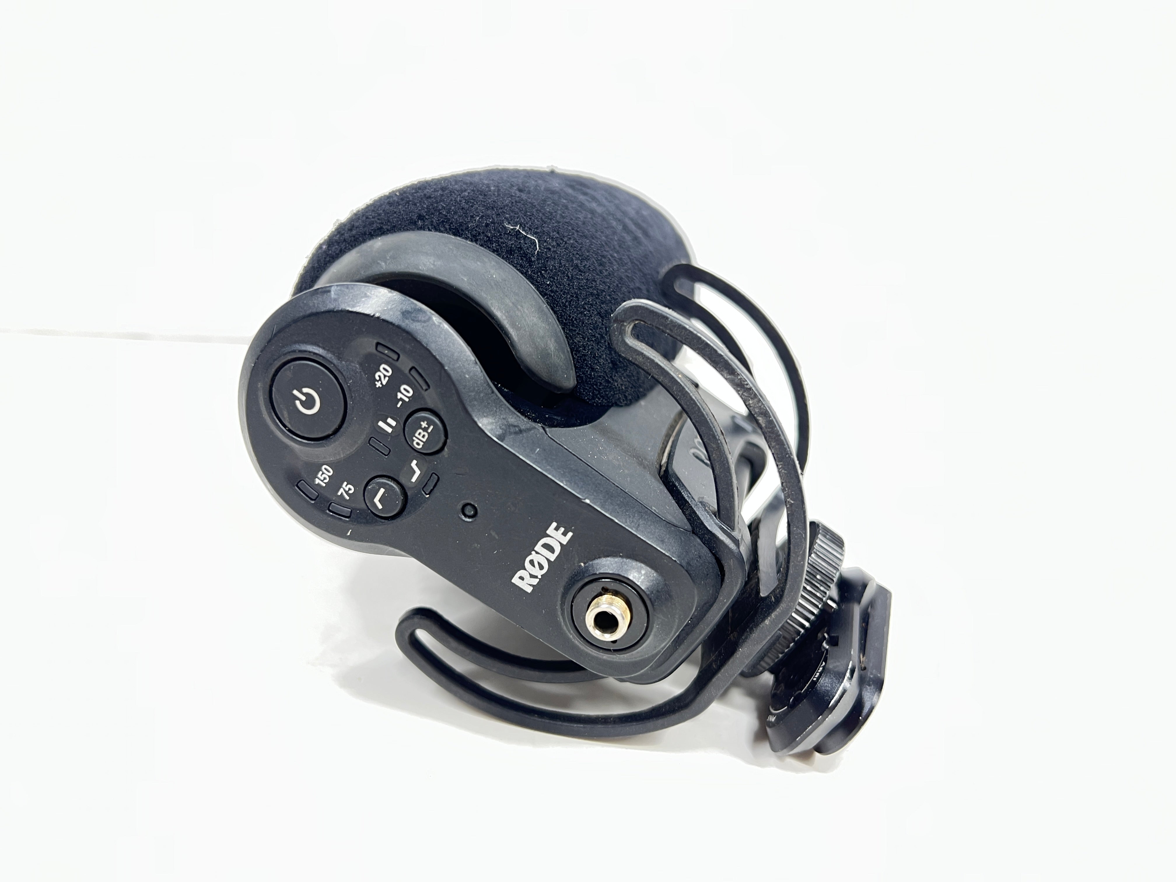 Used Rode VideoMic Pro shotgun microphone with damaged foam windscreen and visible onboard audio controls.