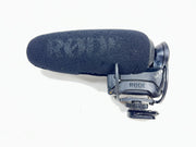 Used Rode VideoMic Pro shotgun microphone with damaged foam windscreen and visible onboard audio controls.