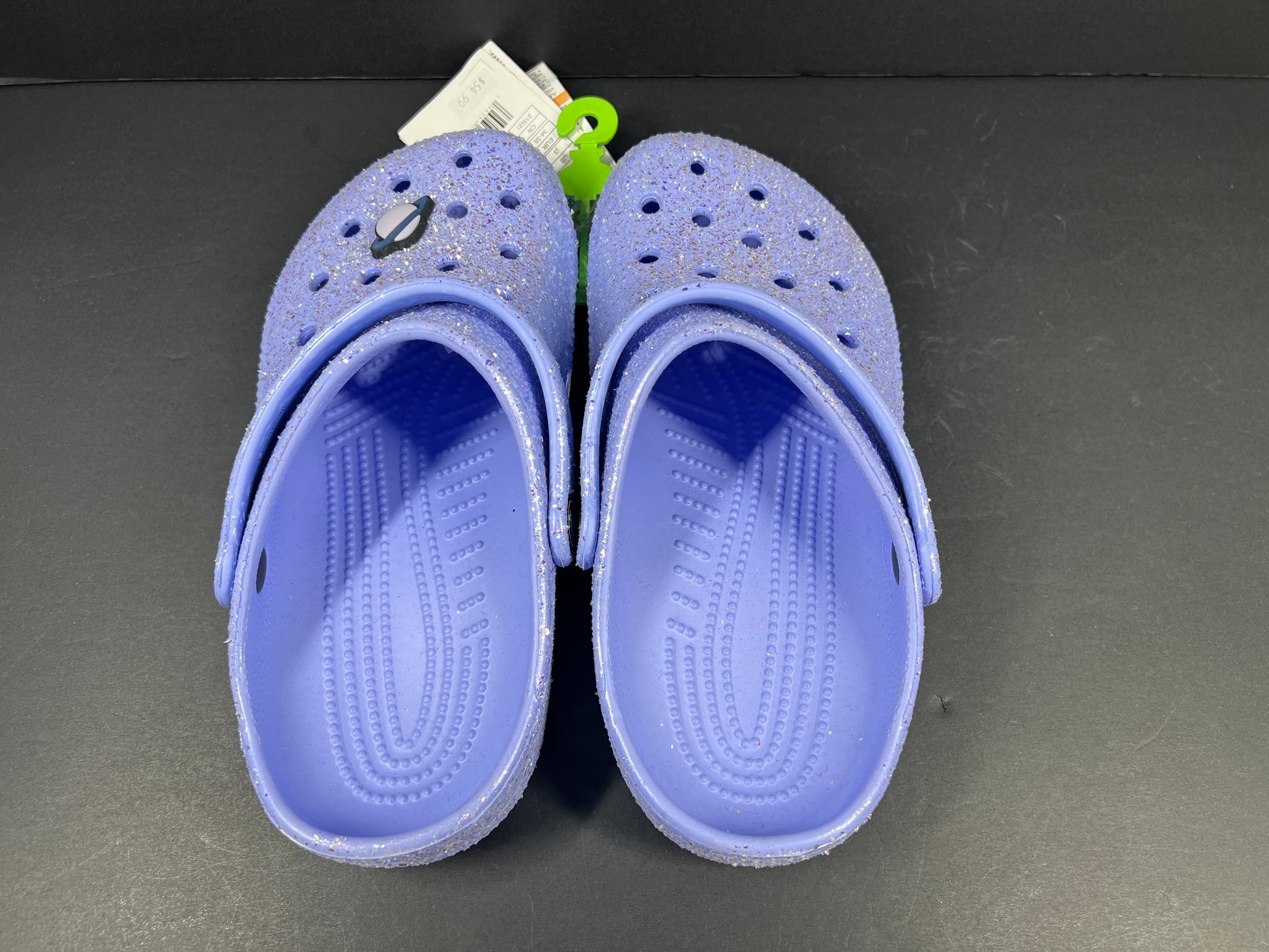 A pair of purple Crocs Classic Glitter Clogs