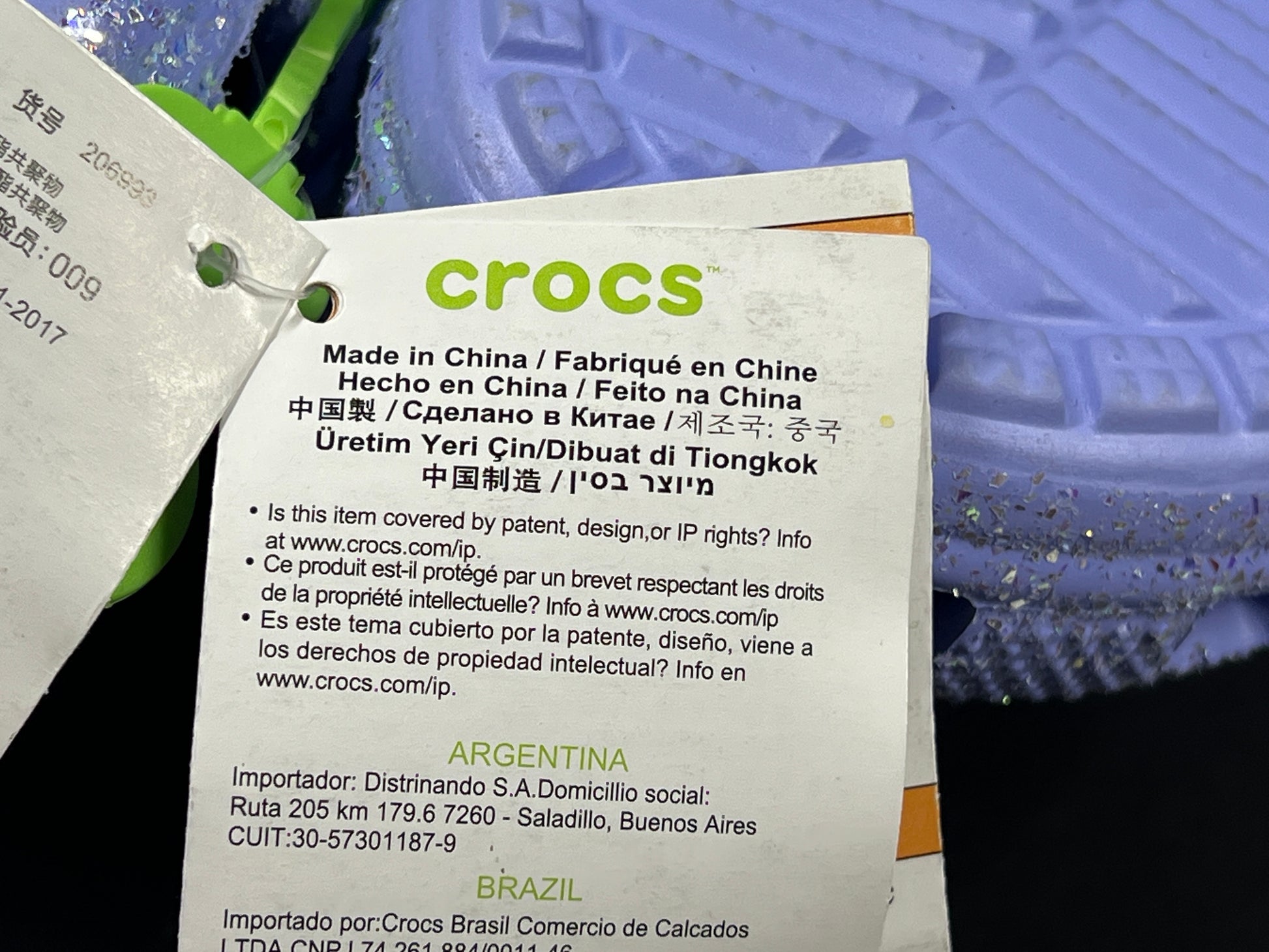 A pair of purple Crocs Classic Glitter Clogs