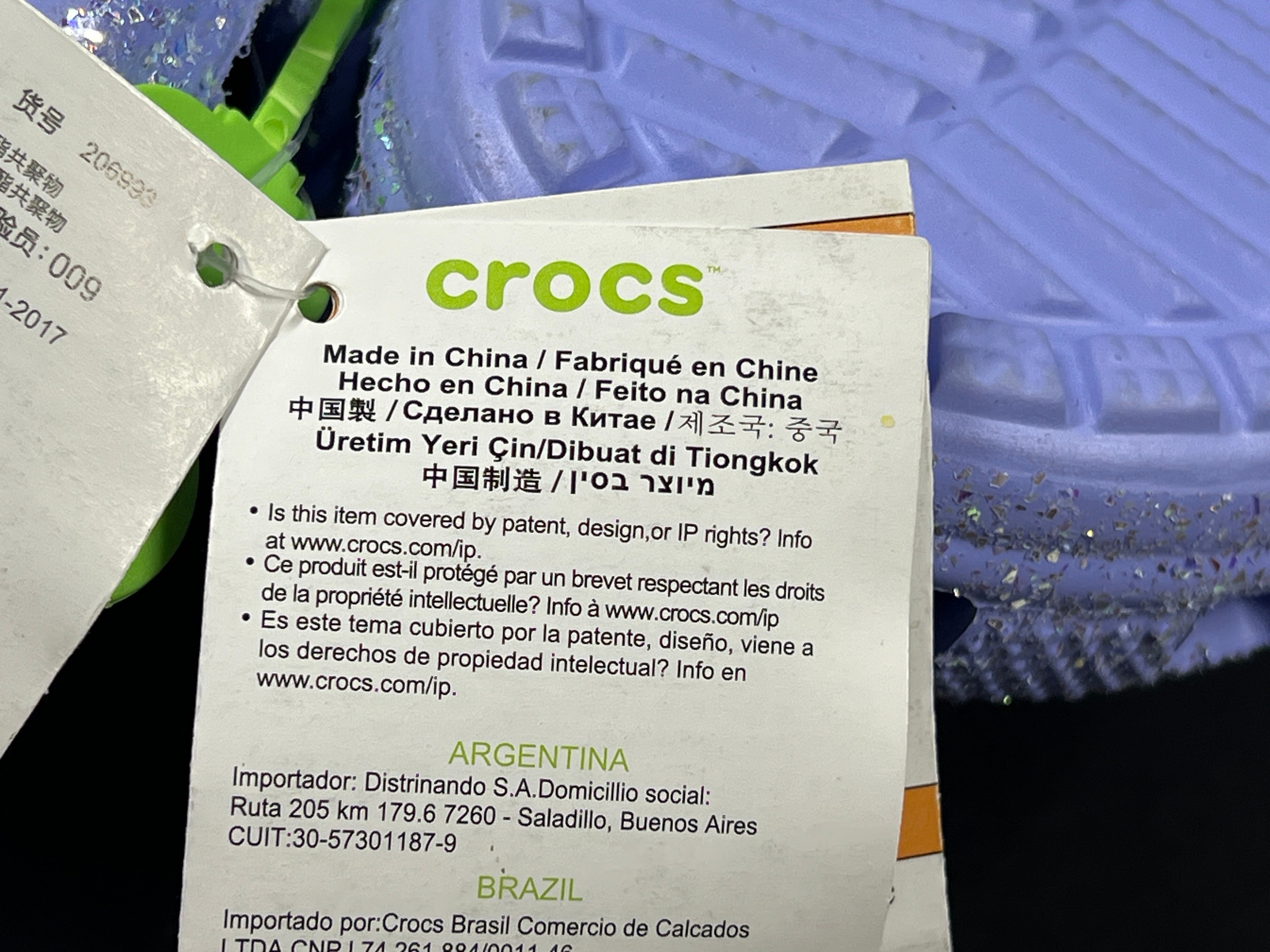 A pair of purple Crocs Classic Glitter Clogs