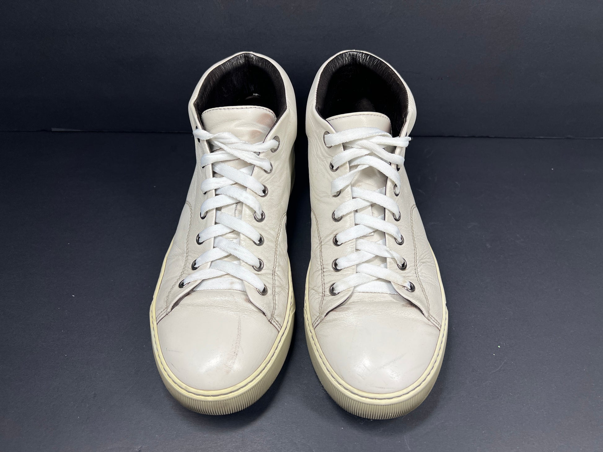 A pair of white leather high-top sneakers by Lanvin