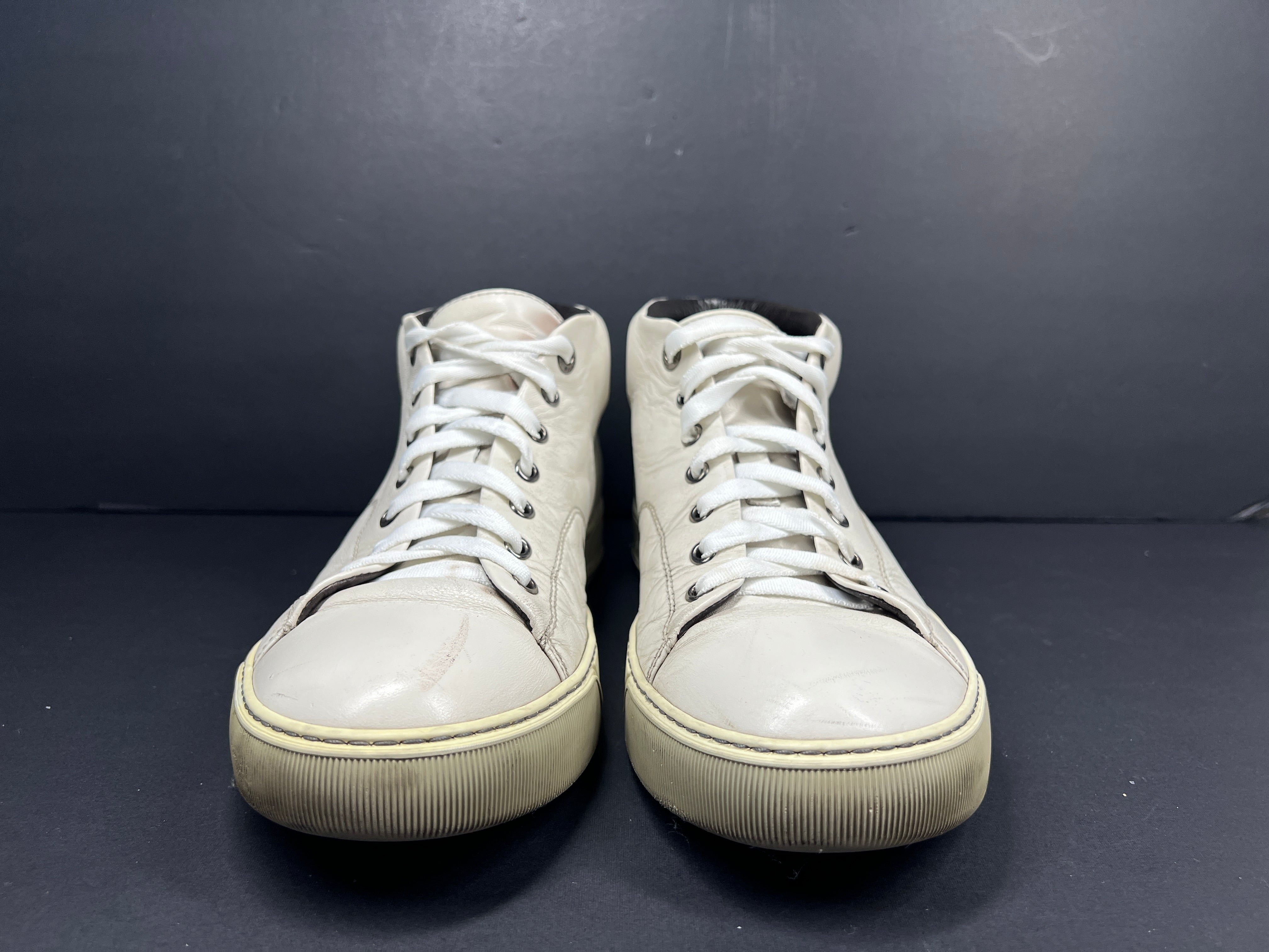 A pair of white leather high-top sneakers by Lanvin