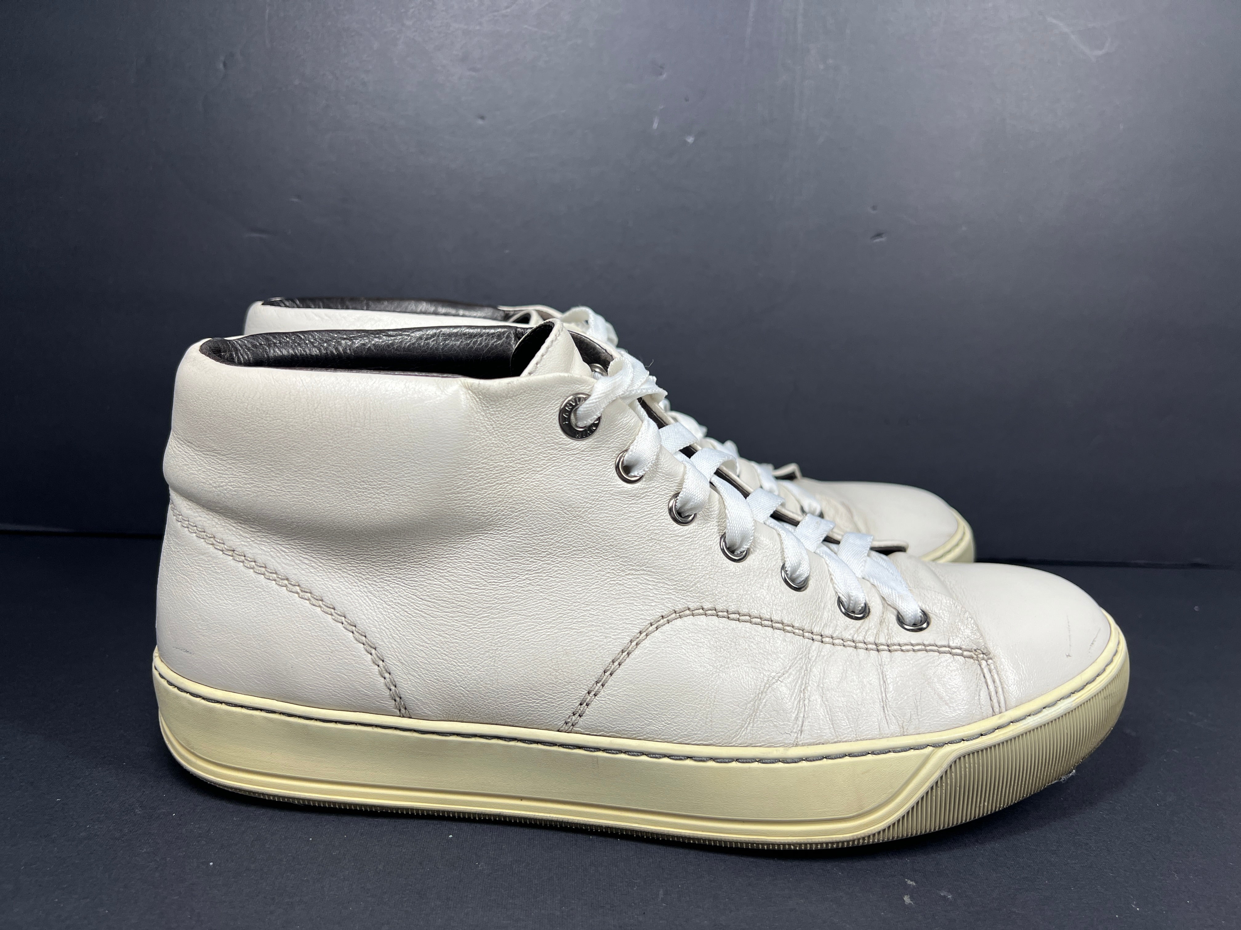 A pair of white leather high-top sneakers by Lanvin