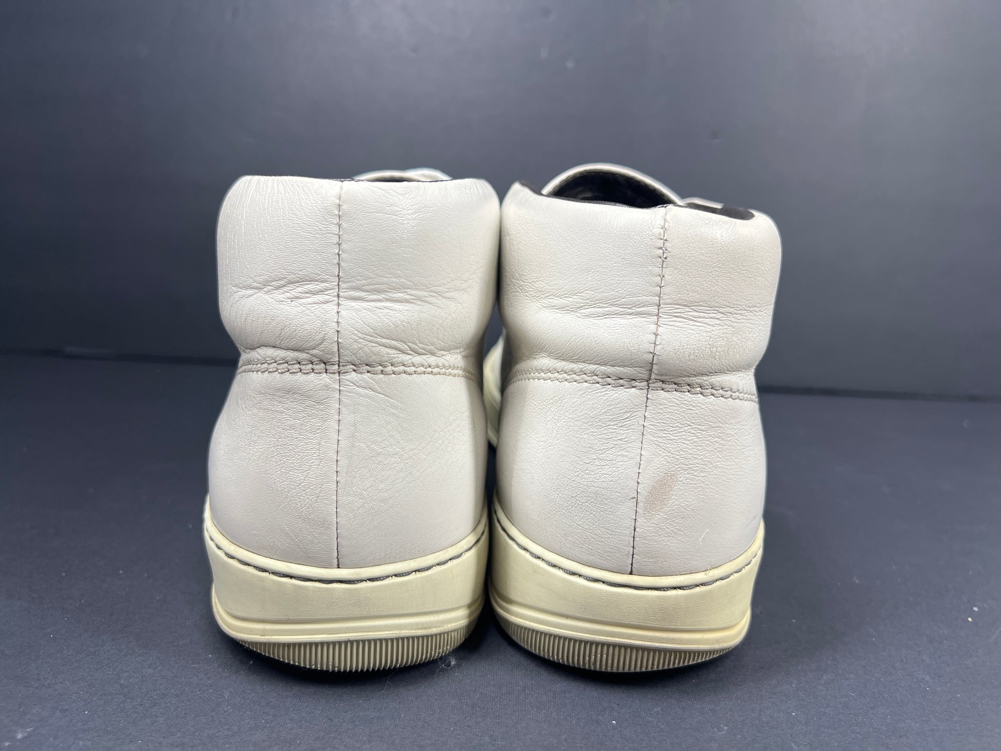 A pair of white leather high-top sneakers by Lanvin