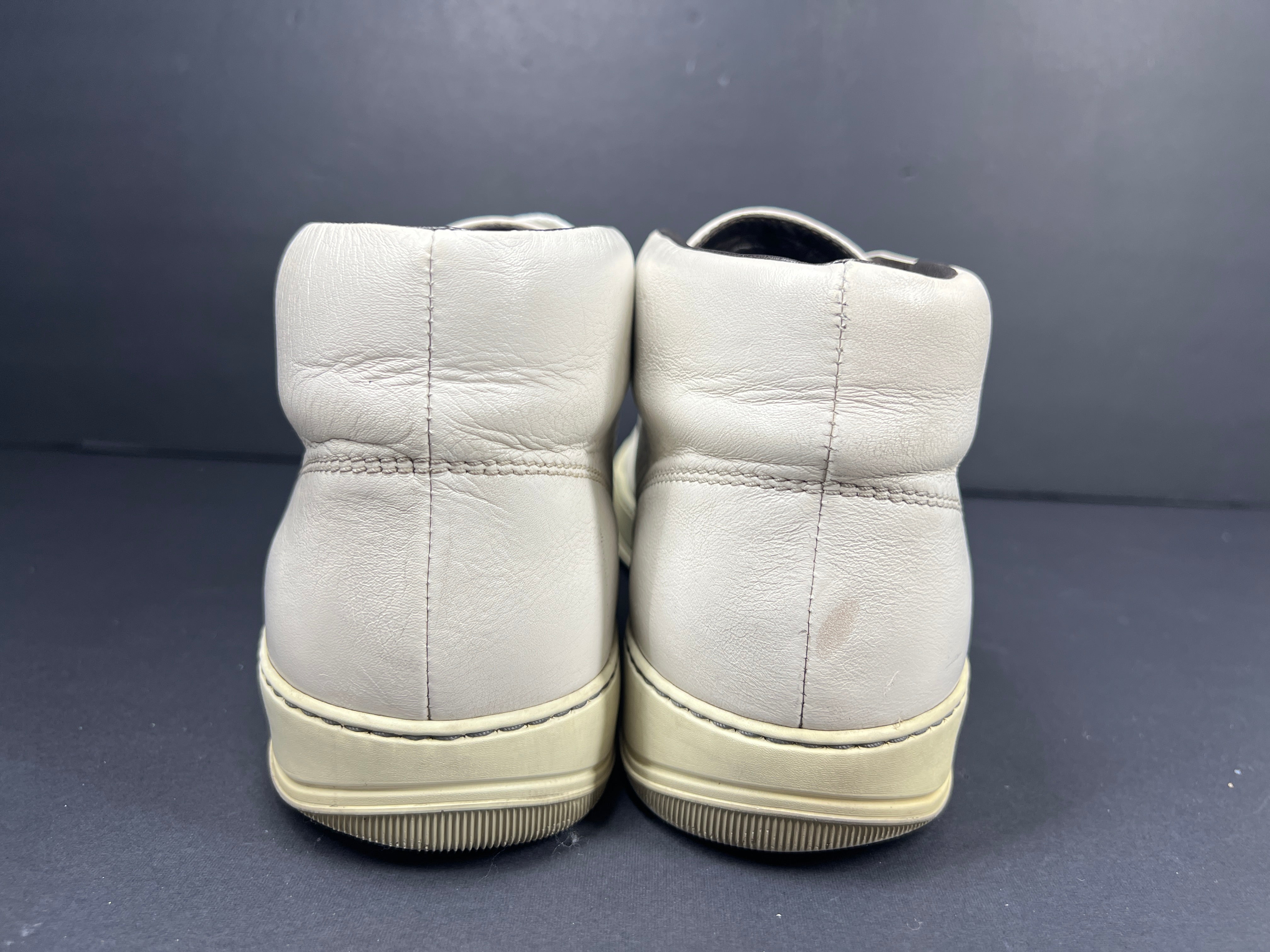 A pair of white leather high-top sneakers by Lanvin