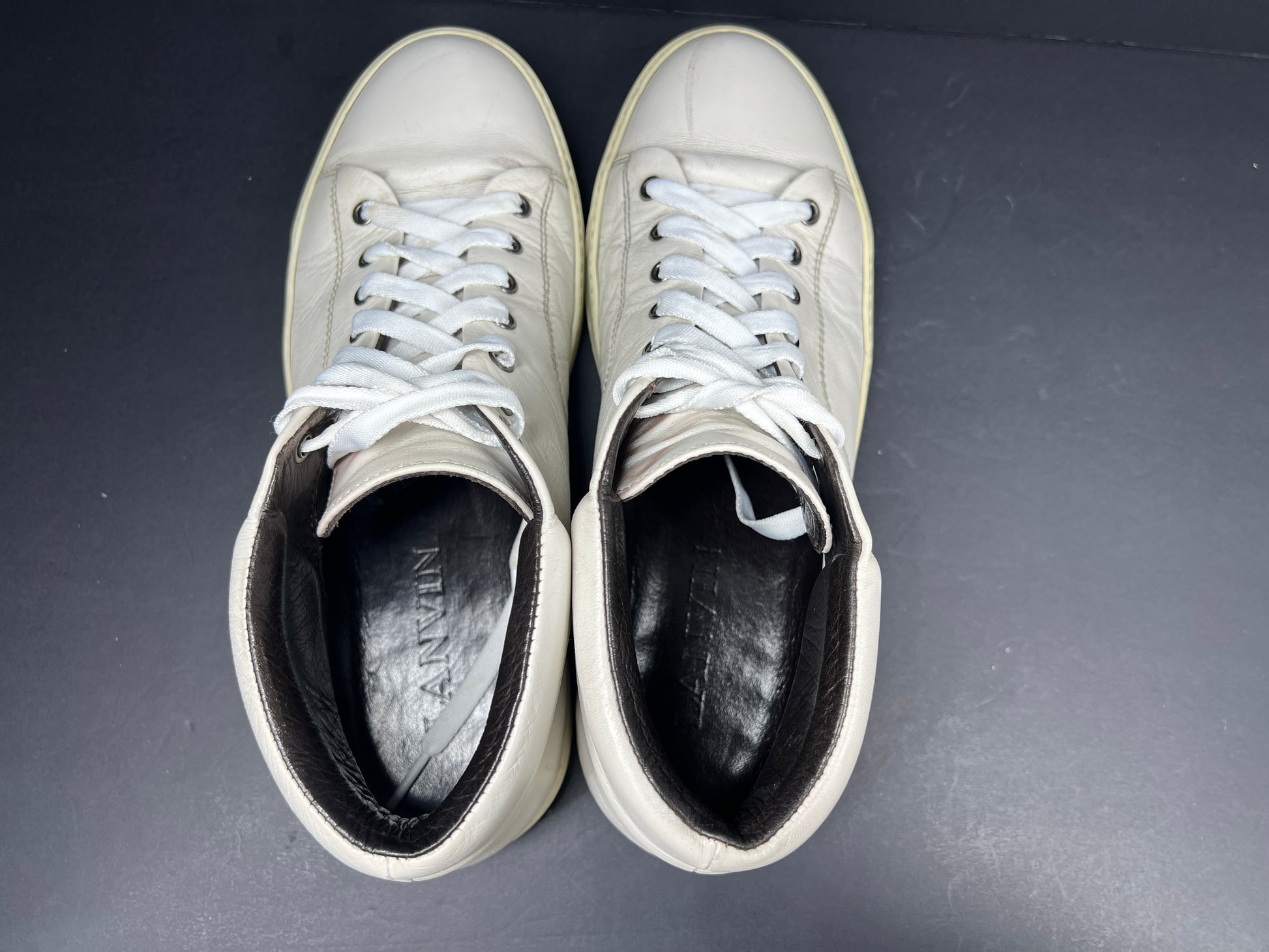 A pair of white leather high-top sneakers by Lanvin