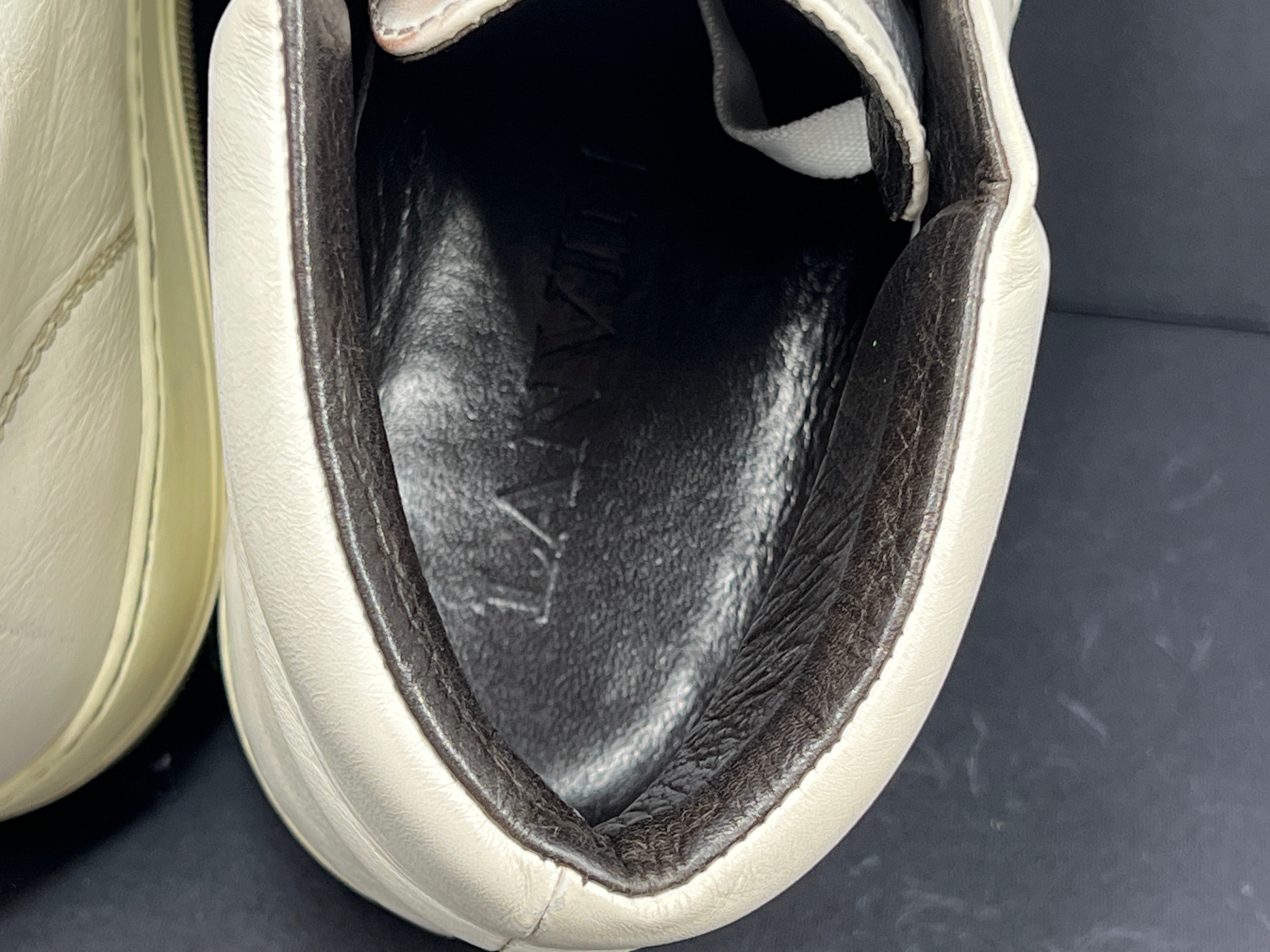 A pair of white leather high-top sneakers by Lanvin