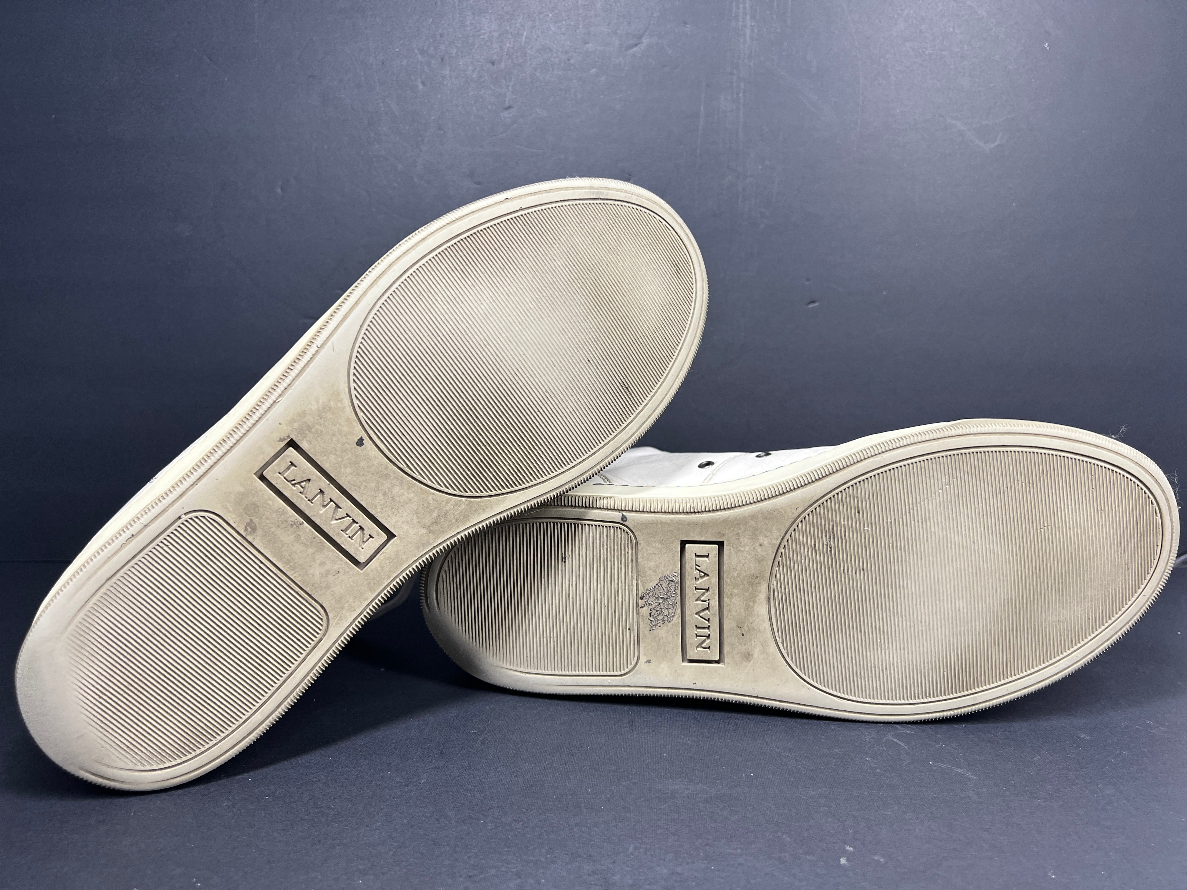 A pair of white leather high-top sneakers by Lanvin