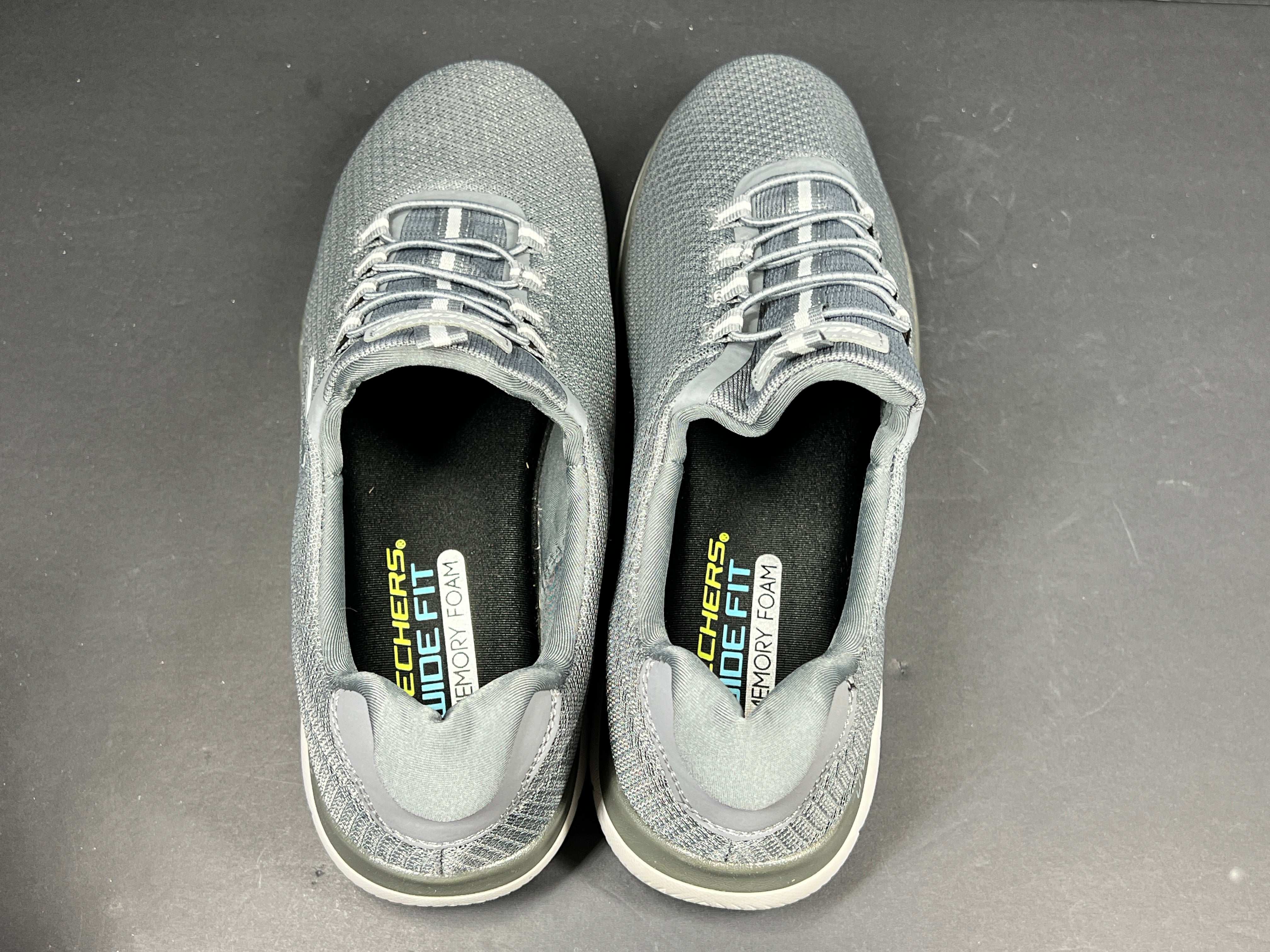 A pair of men's Skechers Wide Fit Memory Foam Charcoal Sneakers