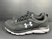 A pair of black Under Armour Charged Assert 9 running shoes for men