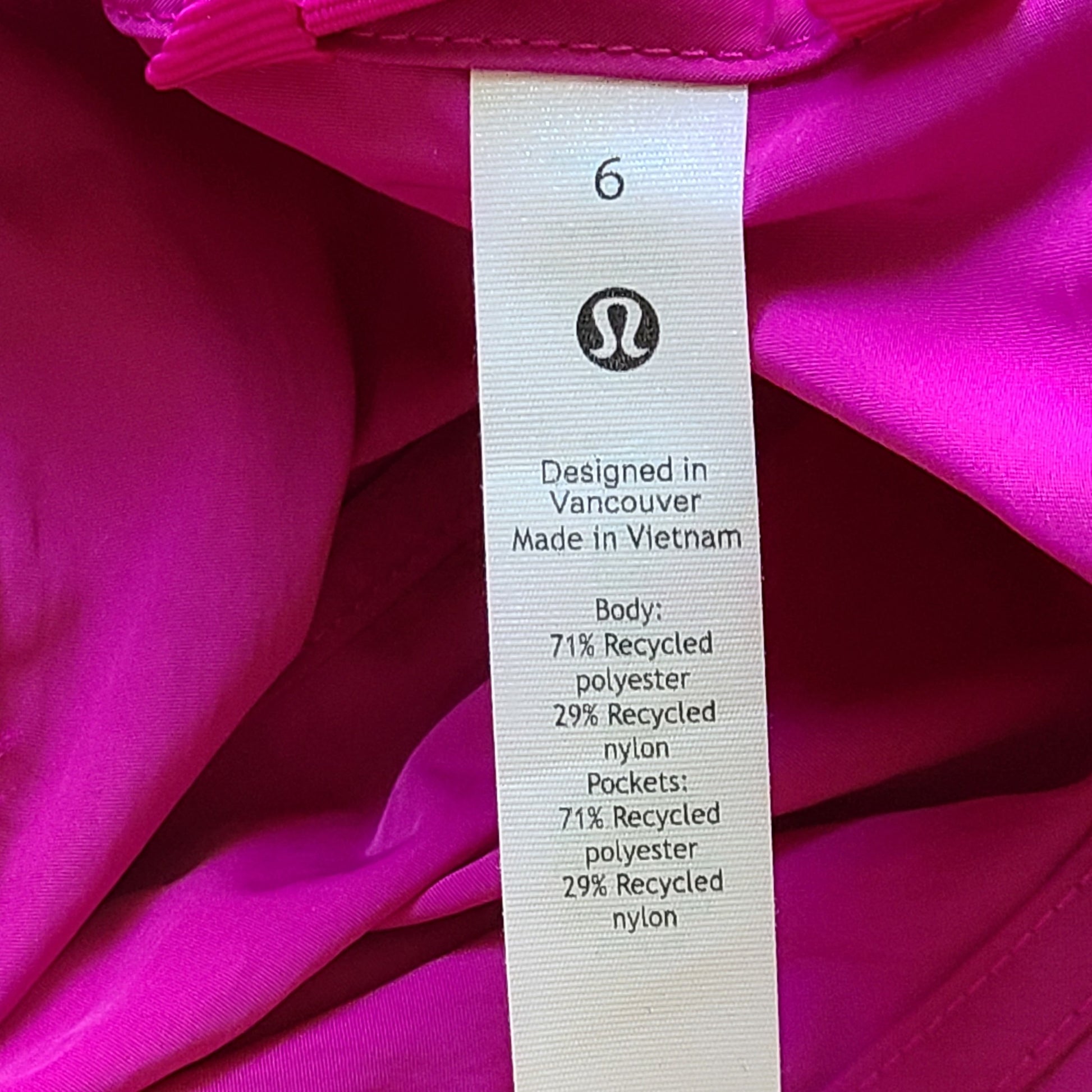 A stylish pink hooded jacket made of recycled materials