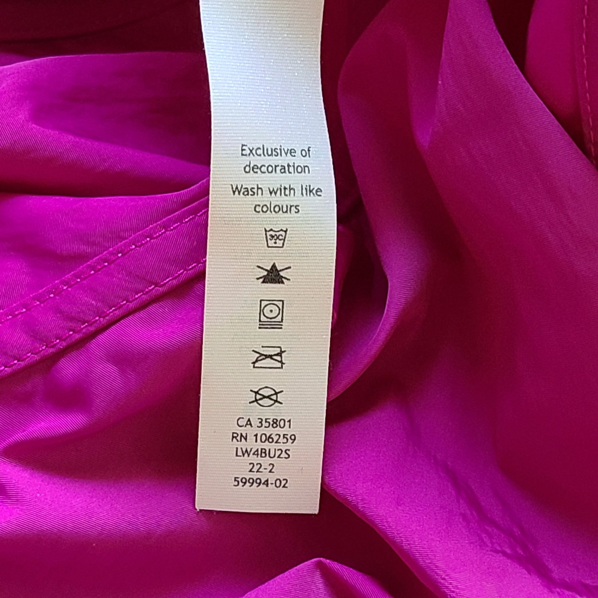 A stylish pink hooded jacket made of recycled materials