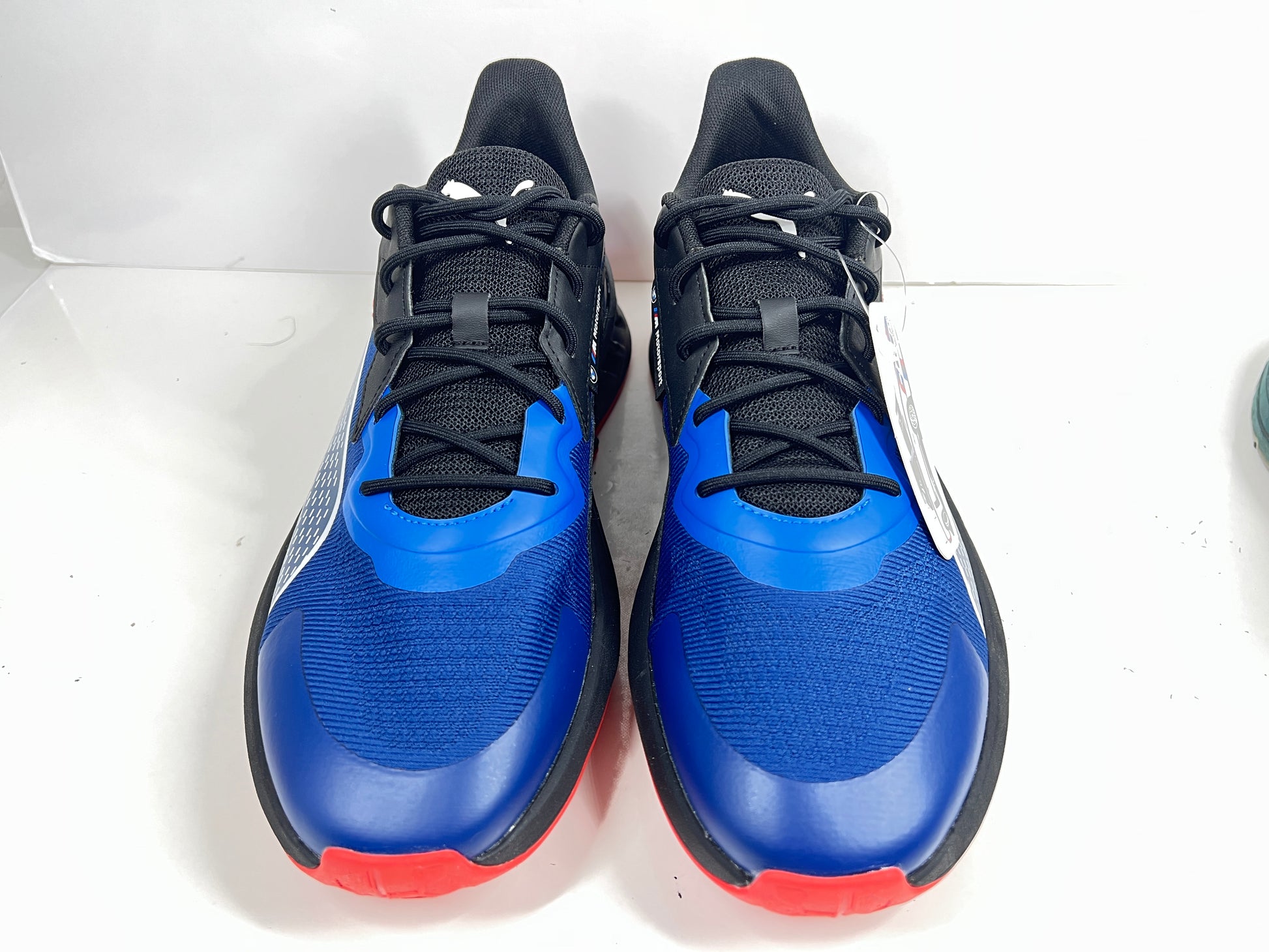 A stylish pair of Puma BMW MMS X-Ray 2 Sneakers in Blue, Black, and Red colors