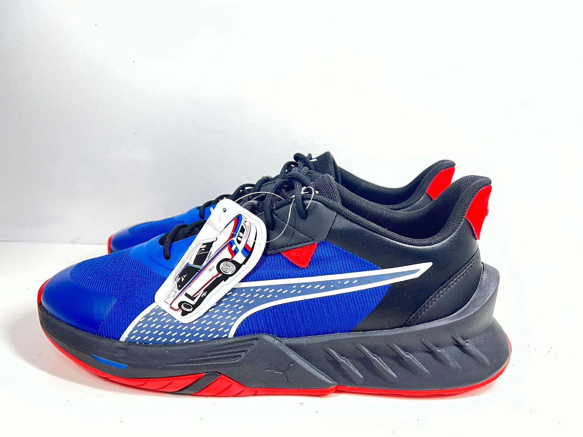 A stylish pair of Puma BMW MMS X-Ray 2 Sneakers in Blue, Black, and Red colors