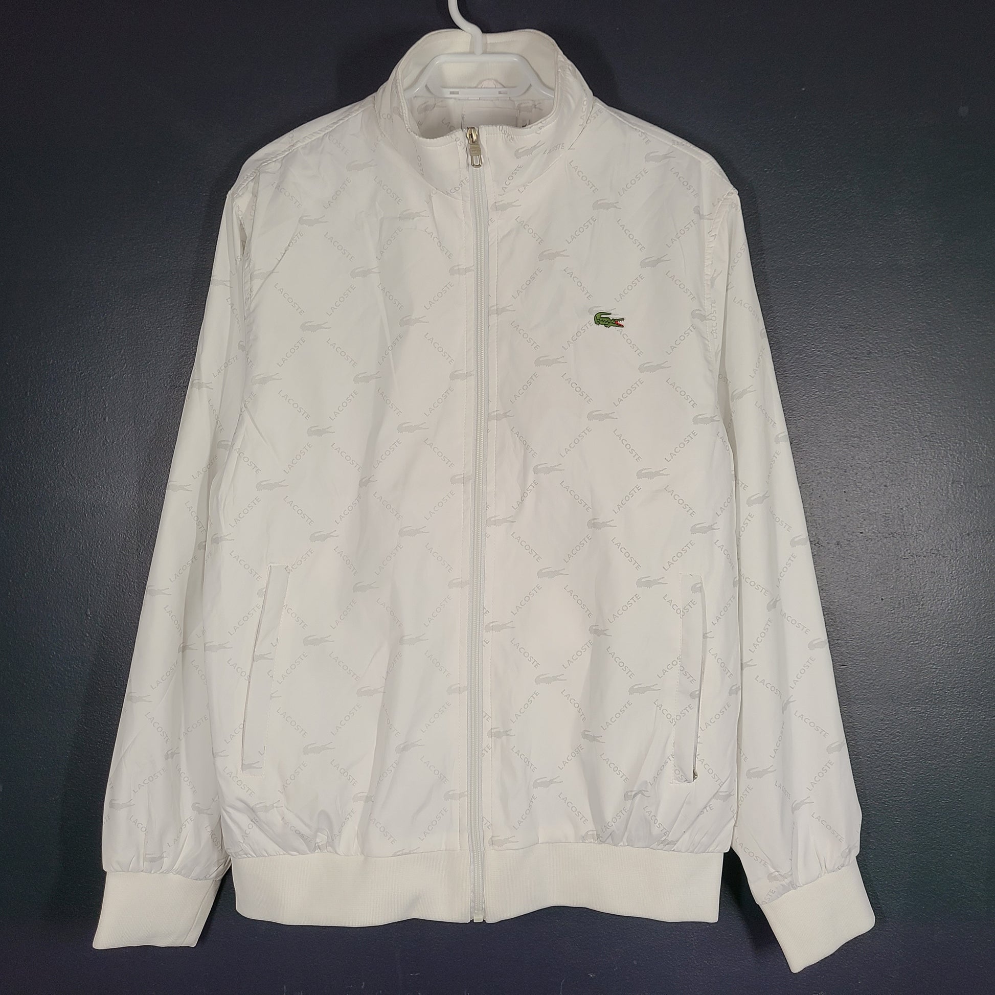 A stylish white Lacoste jacket for men in XL size.