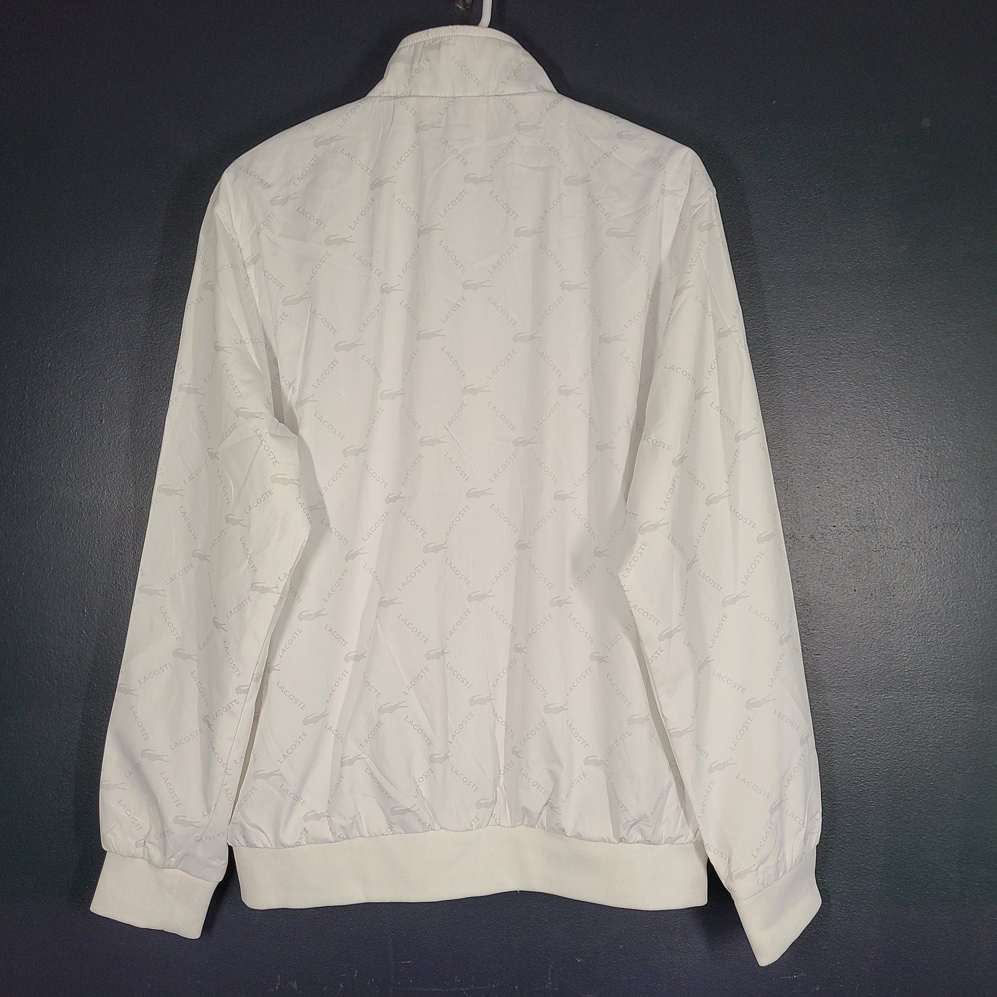 A stylish white Lacoste jacket for men in XL size.