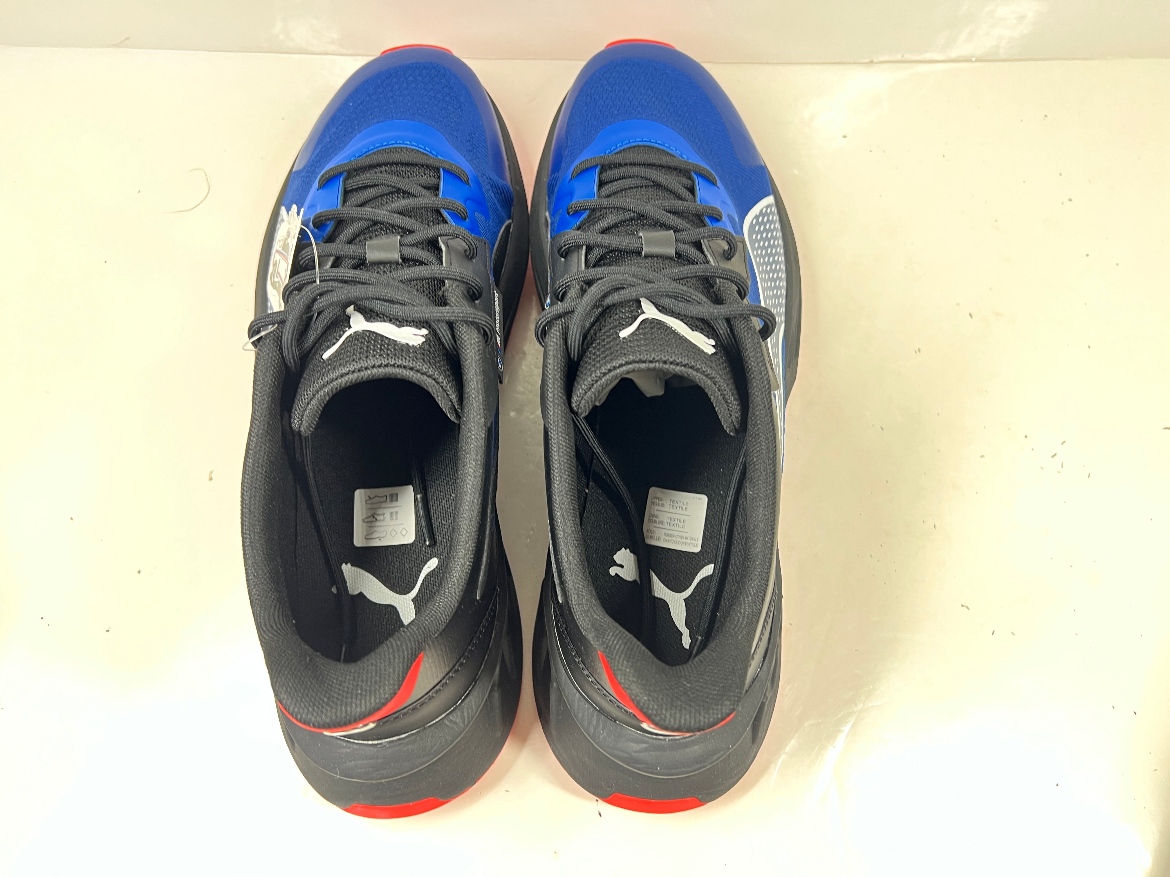 A stylish pair of Puma BMW MMS X-Ray 2 Sneakers in Blue, Black, and Red colors