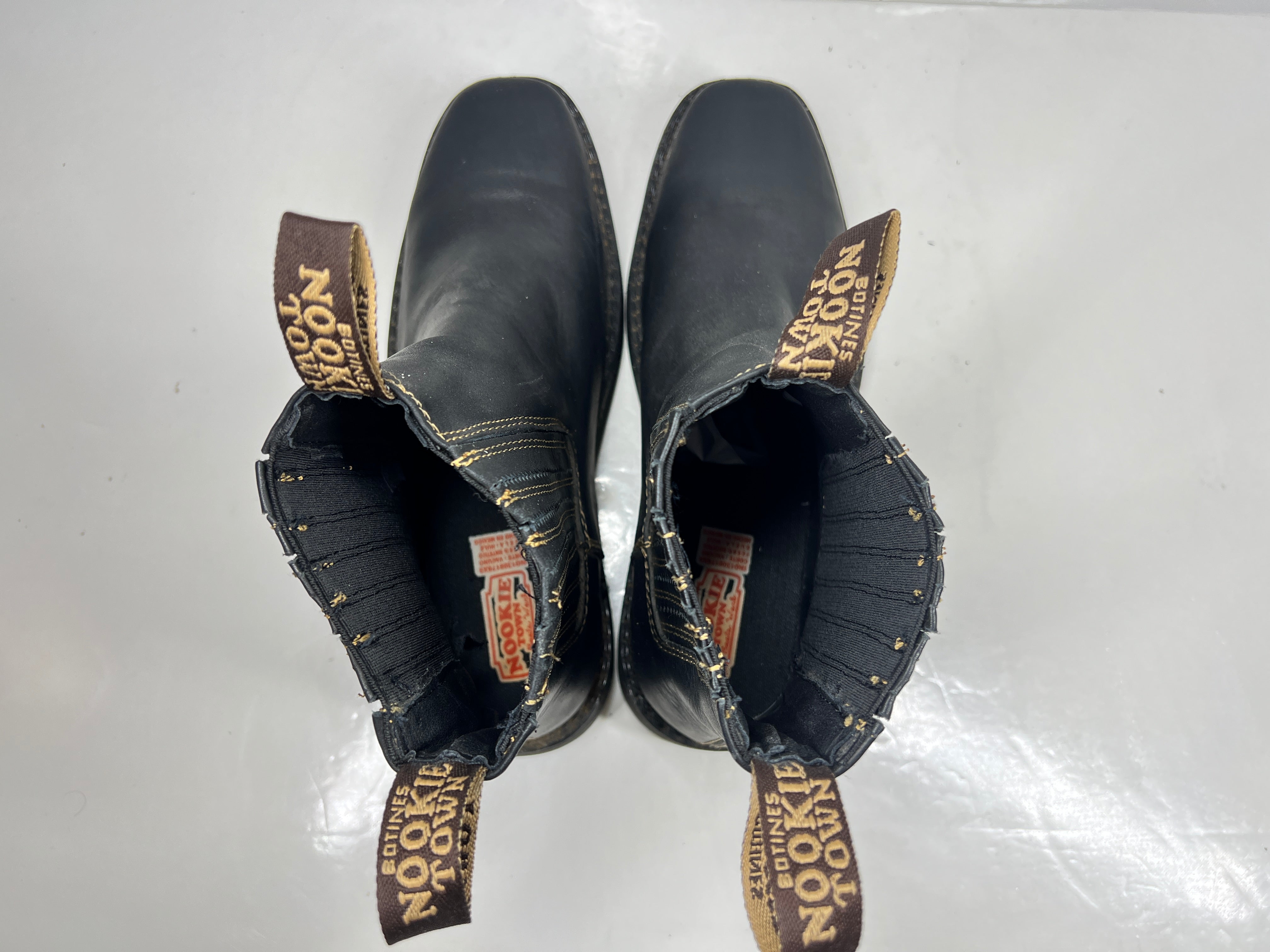 A pair of black leather women's boots by Nookie Town.