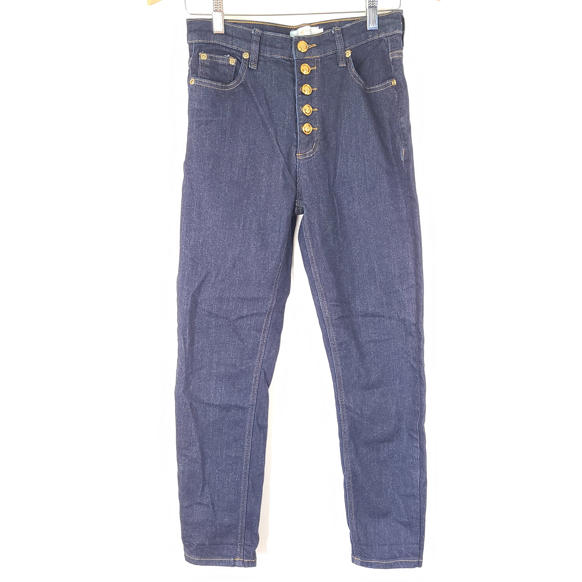 A pair of dark denim women's high-rise skinny jeans from Tory Burch