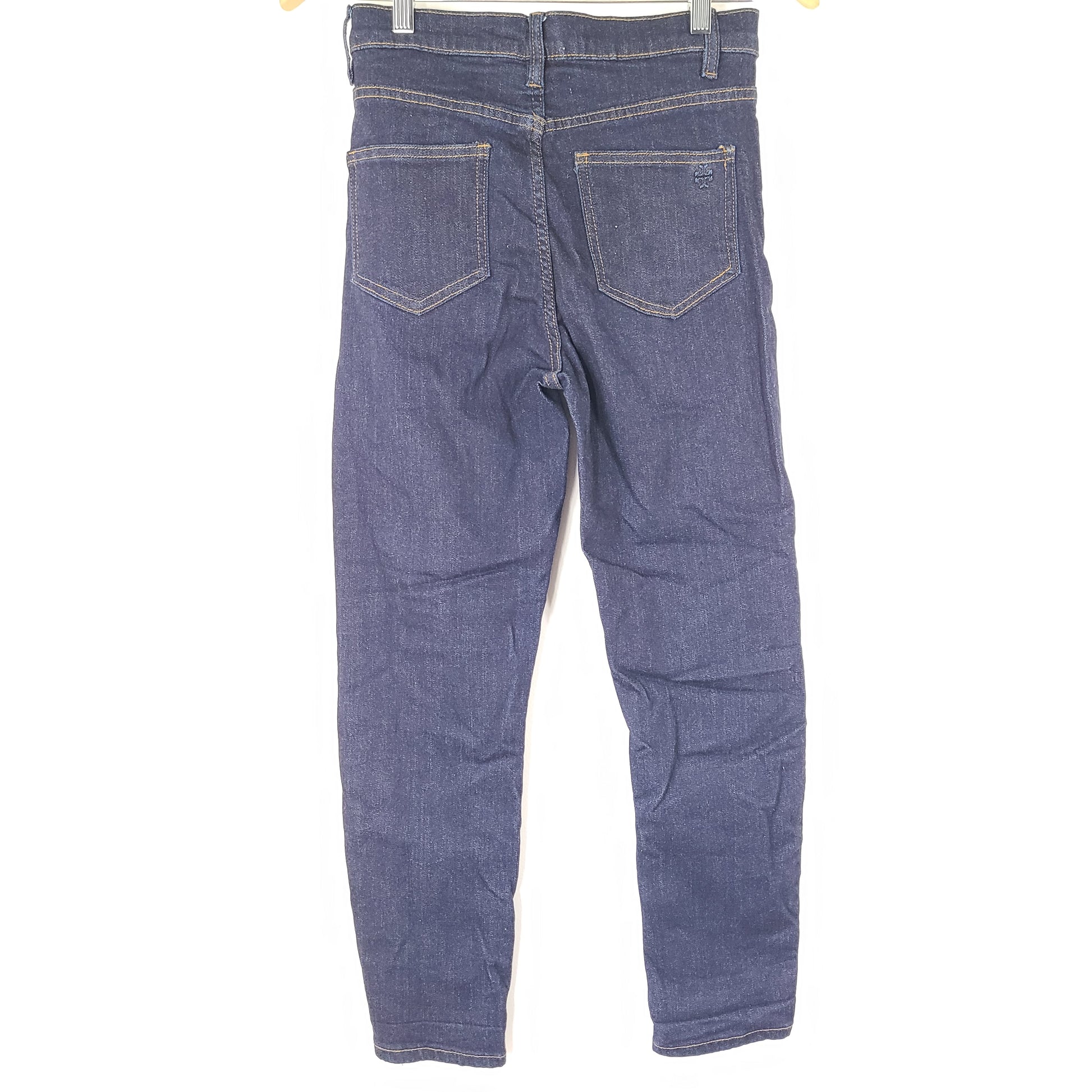 A pair of dark denim women's high-rise skinny jeans from Tory Burch