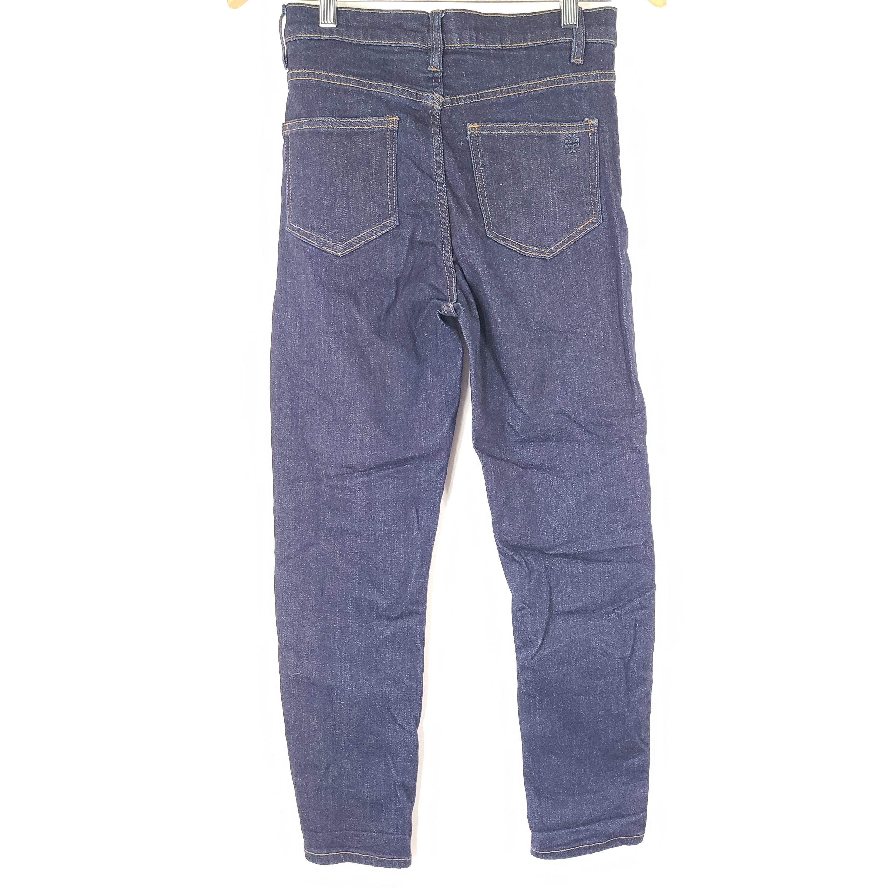 A pair of dark denim women's high-rise skinny jeans from Tory Burch