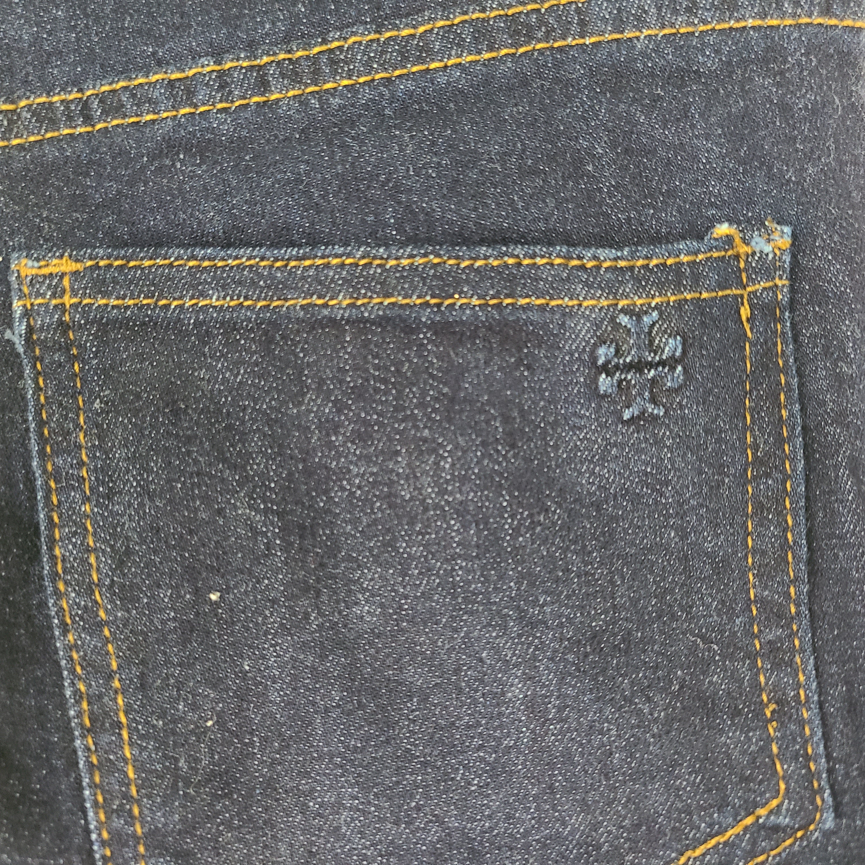 A pair of dark denim women's high-rise skinny jeans from Tory Burch