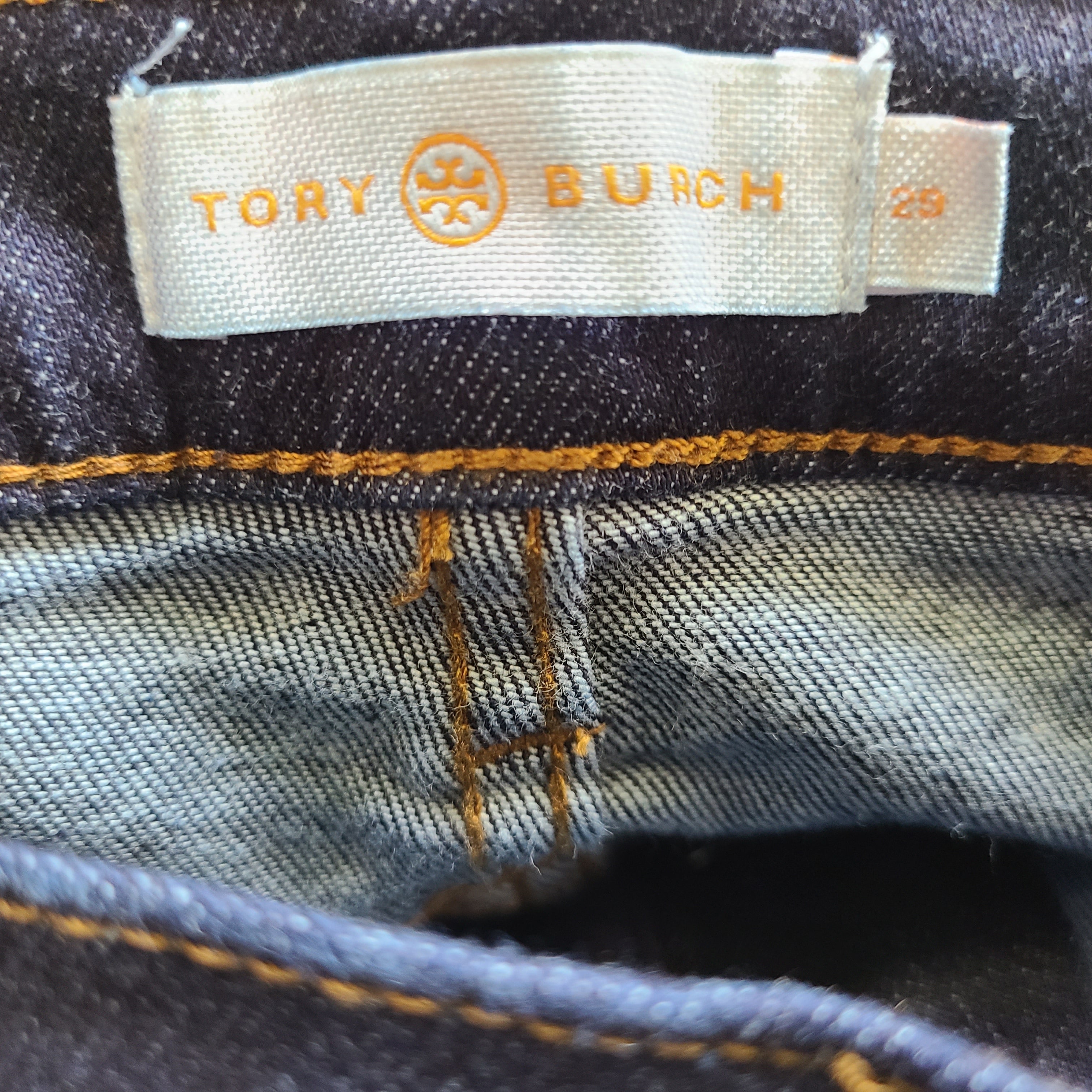 A pair of dark denim women's high-rise skinny jeans from Tory Burch