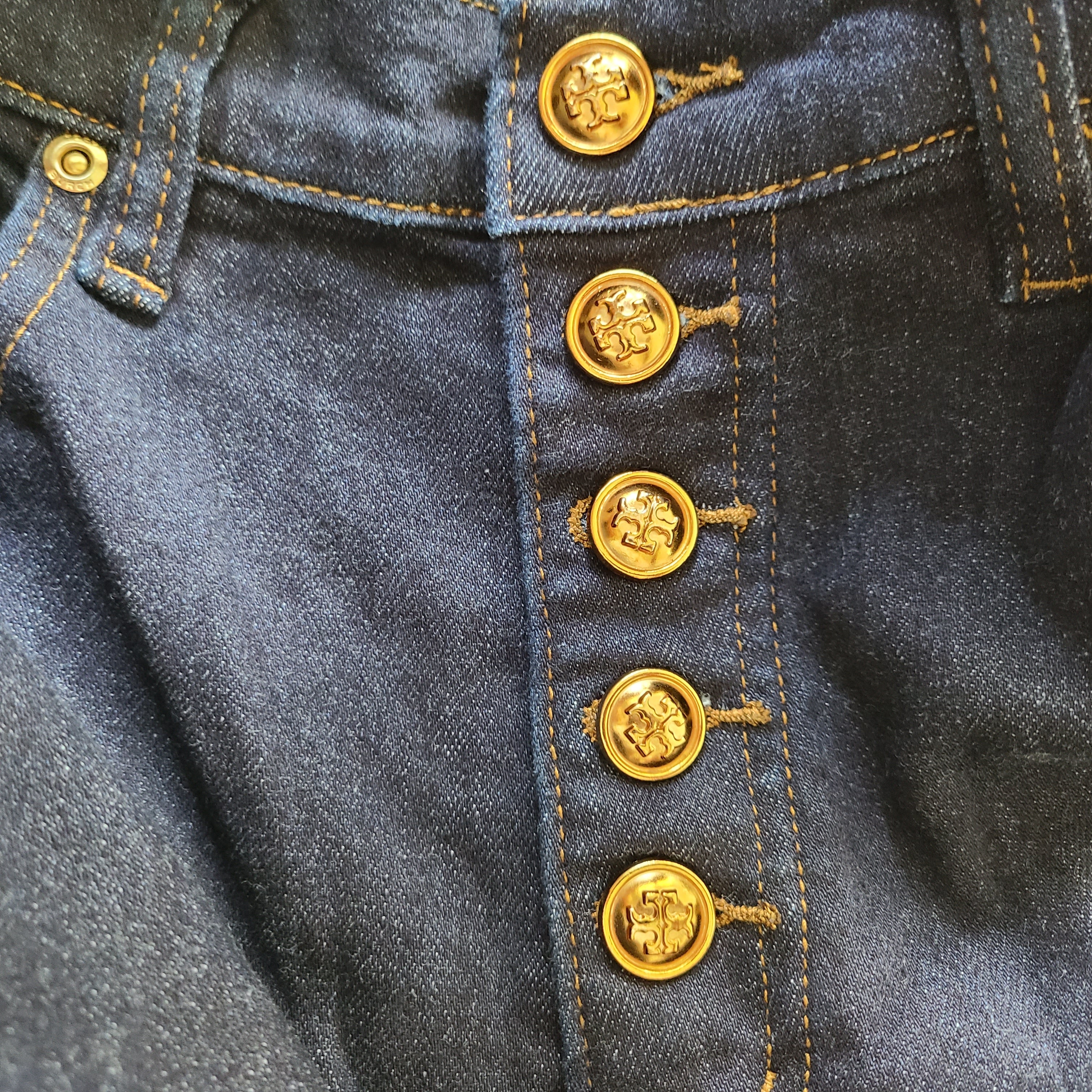 A pair of dark denim women's high-rise skinny jeans from Tory Burch