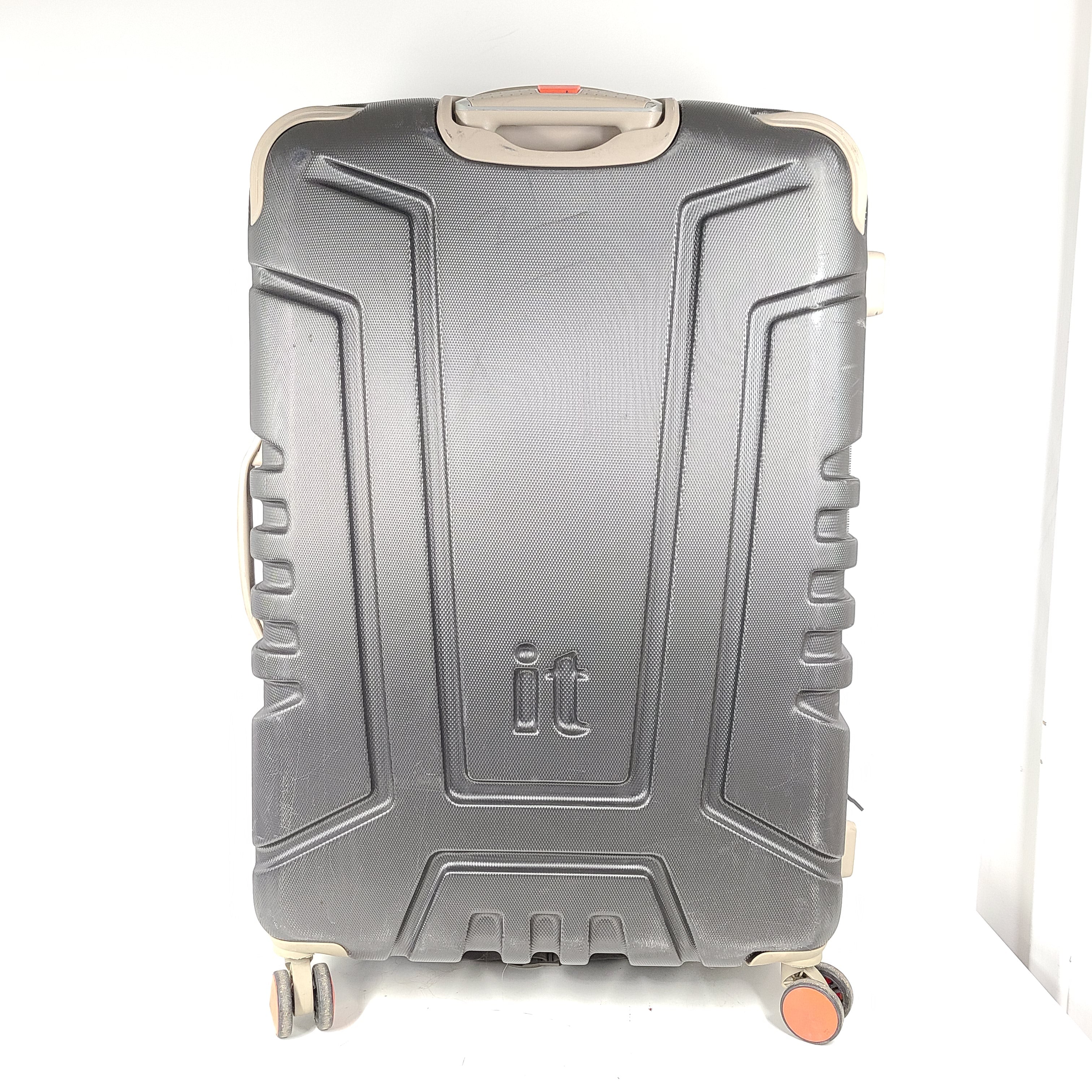 A red hard shell spinner suitcase by it Luggage
