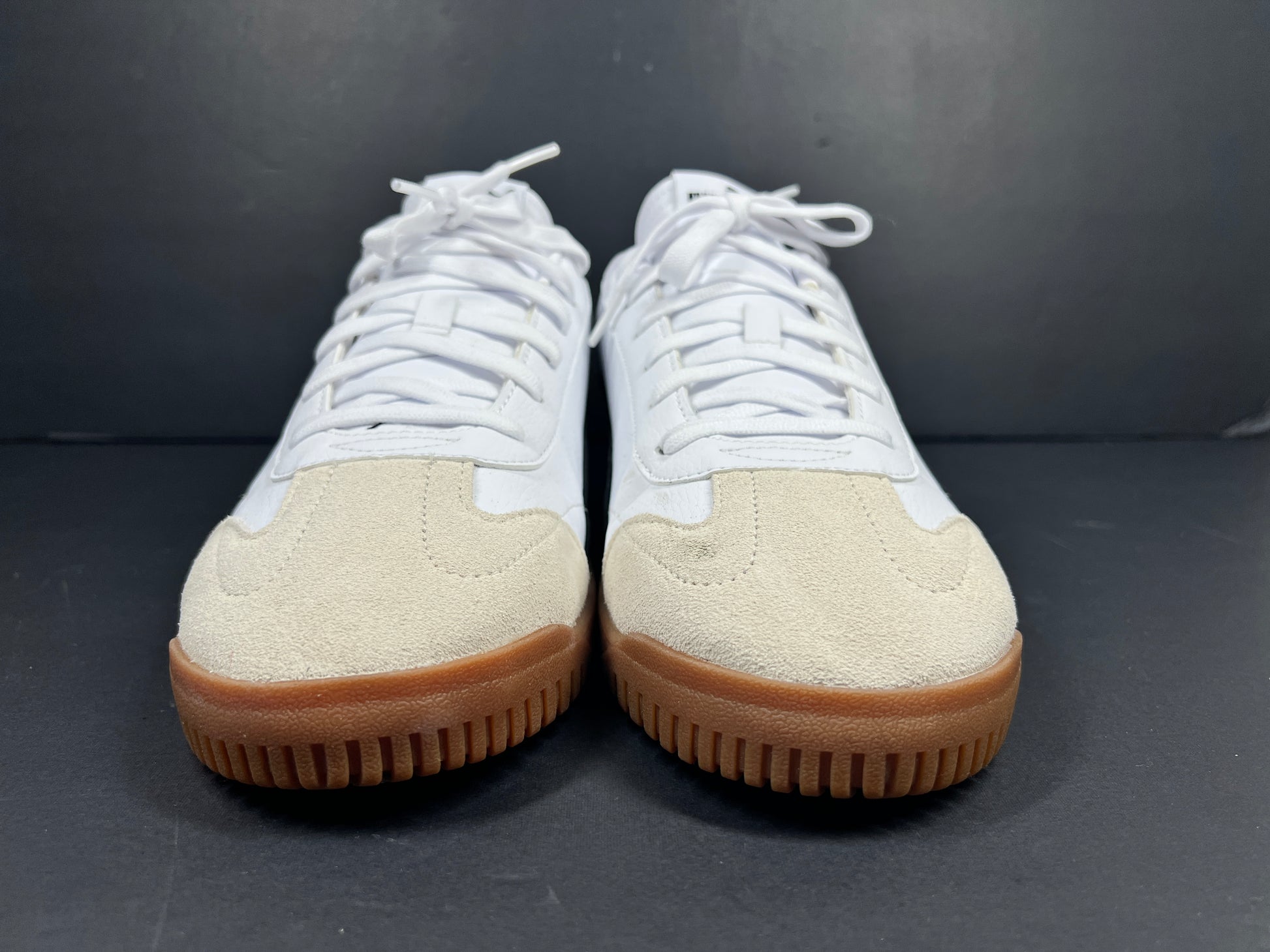 A pair of stylish white and black Puma Men's Sneakers in suede material