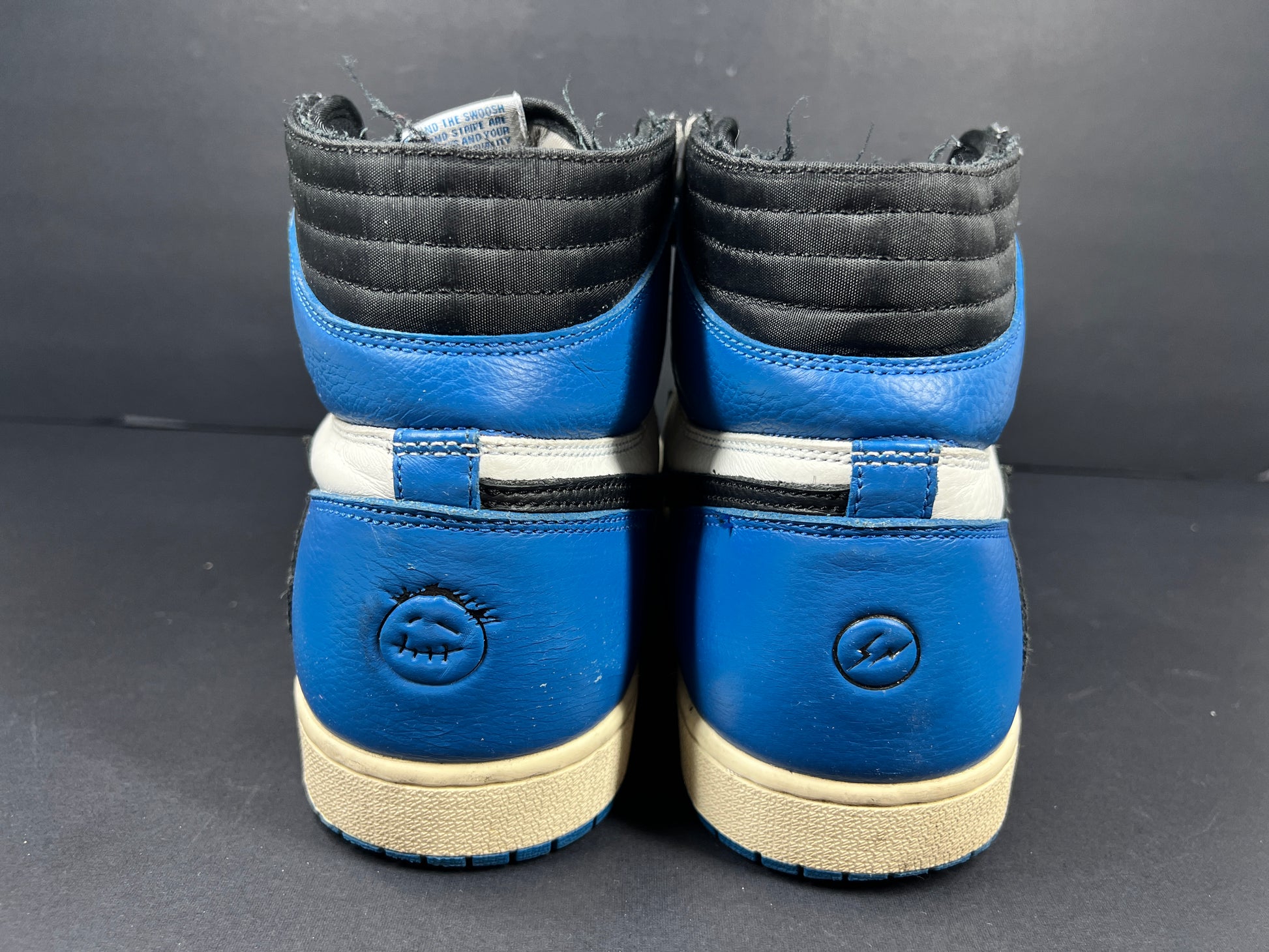 A pair of blue Nike Air Jordan 1 Retro High OG sneakers