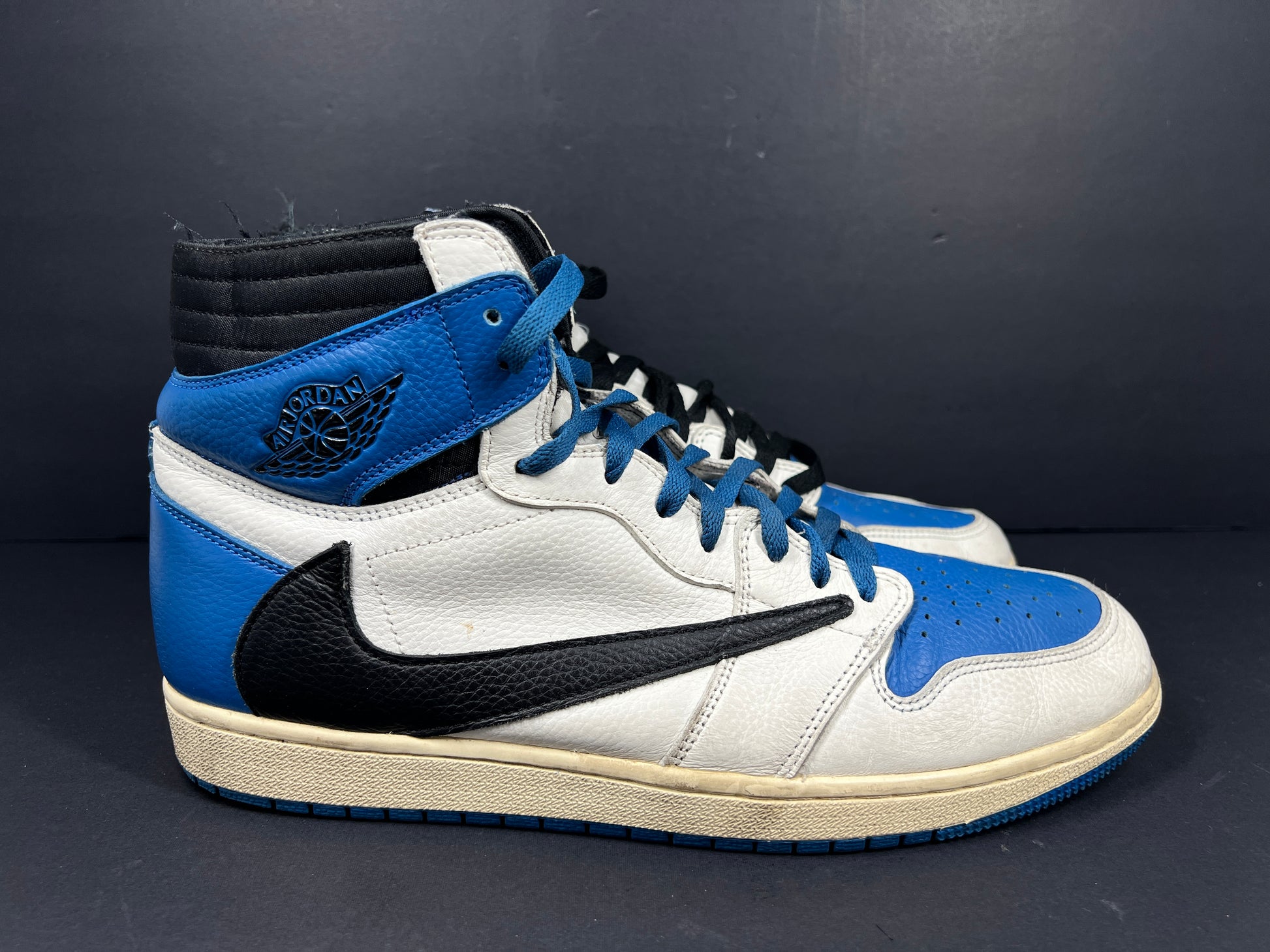 A pair of blue Nike Air Jordan 1 Retro High OG sneakers