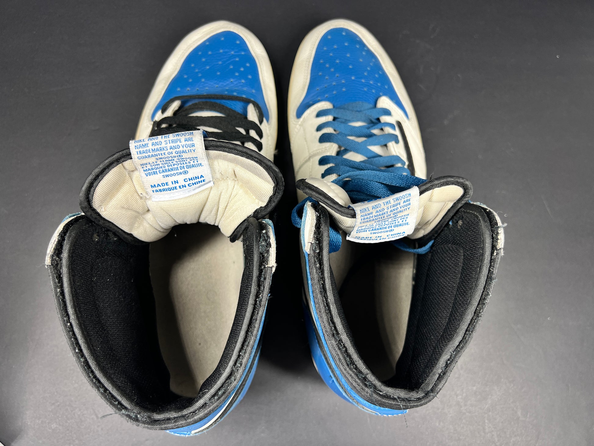 A pair of blue Nike Air Jordan 1 Retro High OG sneakers