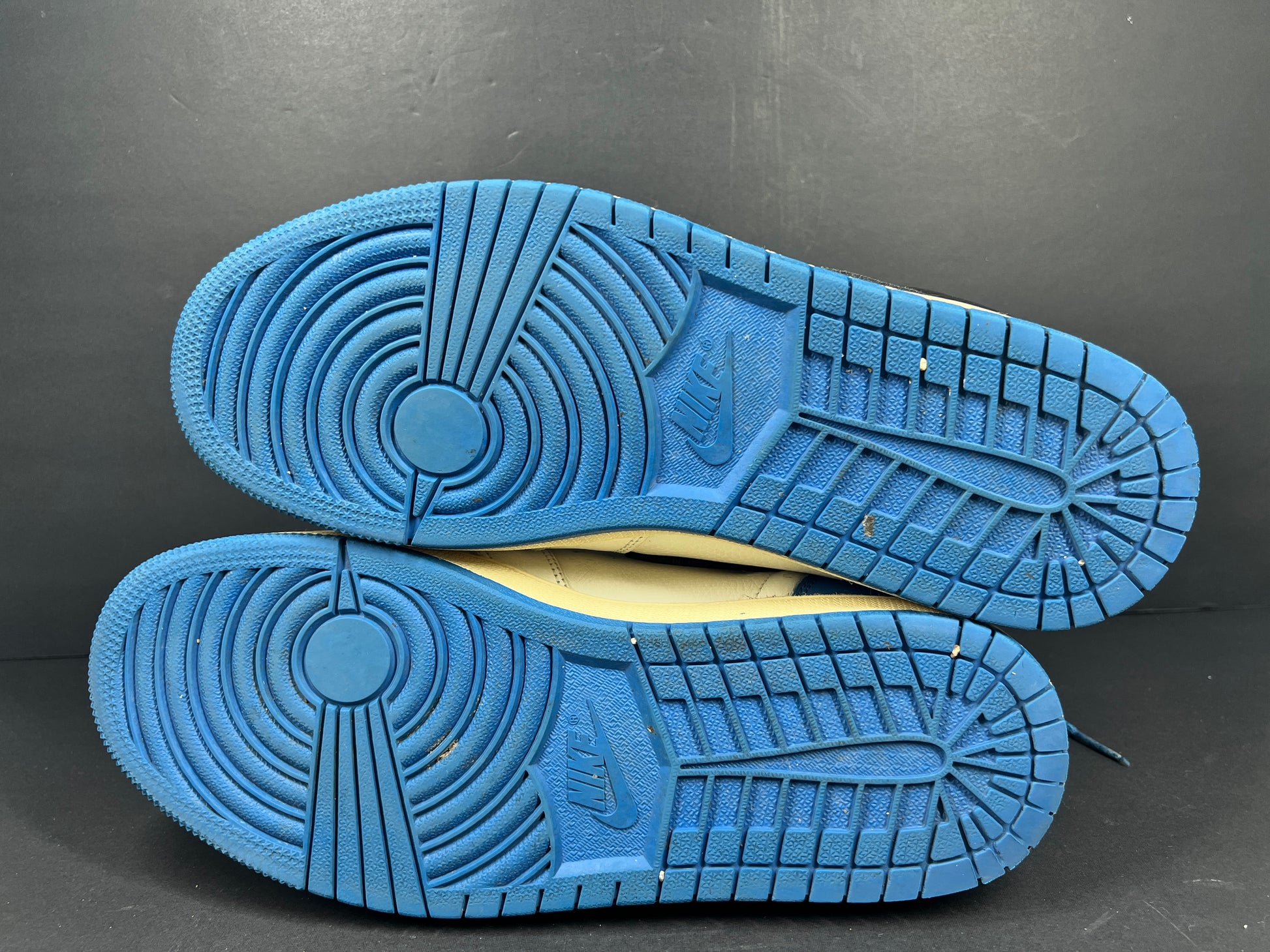 A pair of blue Nike Air Jordan 1 Retro High OG sneakers