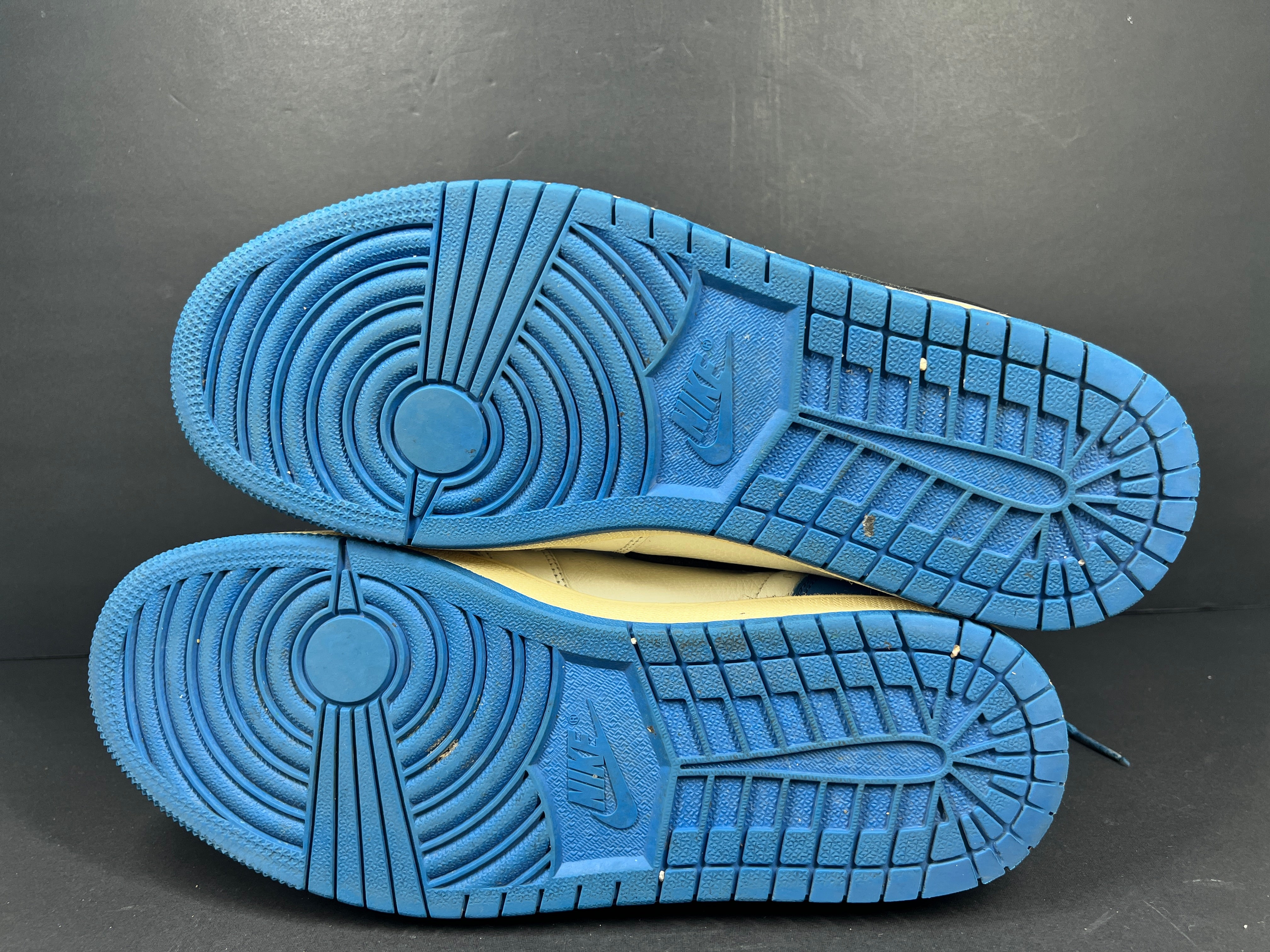 A pair of blue Nike Air Jordan 1 Retro High OG sneakers
