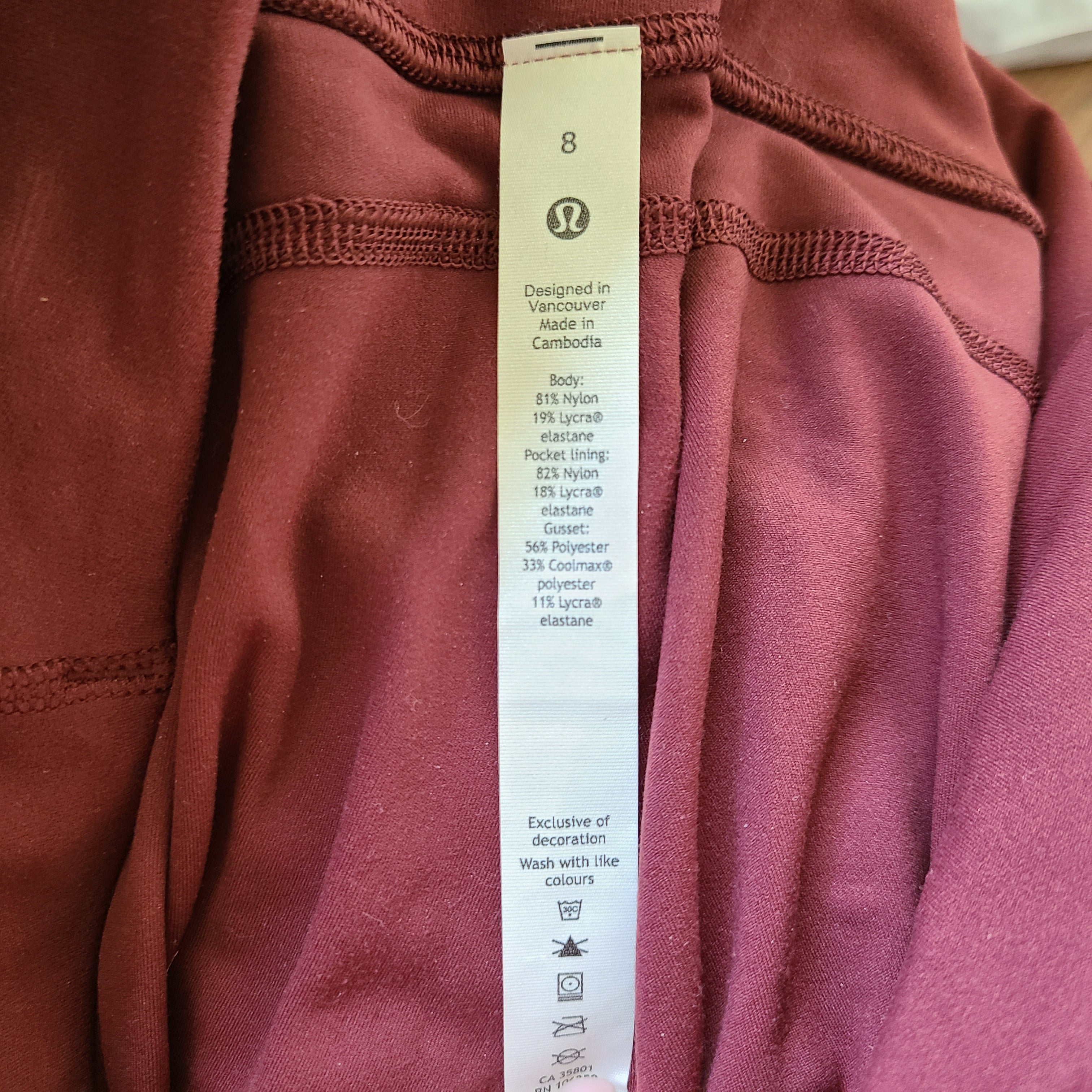 A pair of maroon Lululemon Yoga Pants in size 8