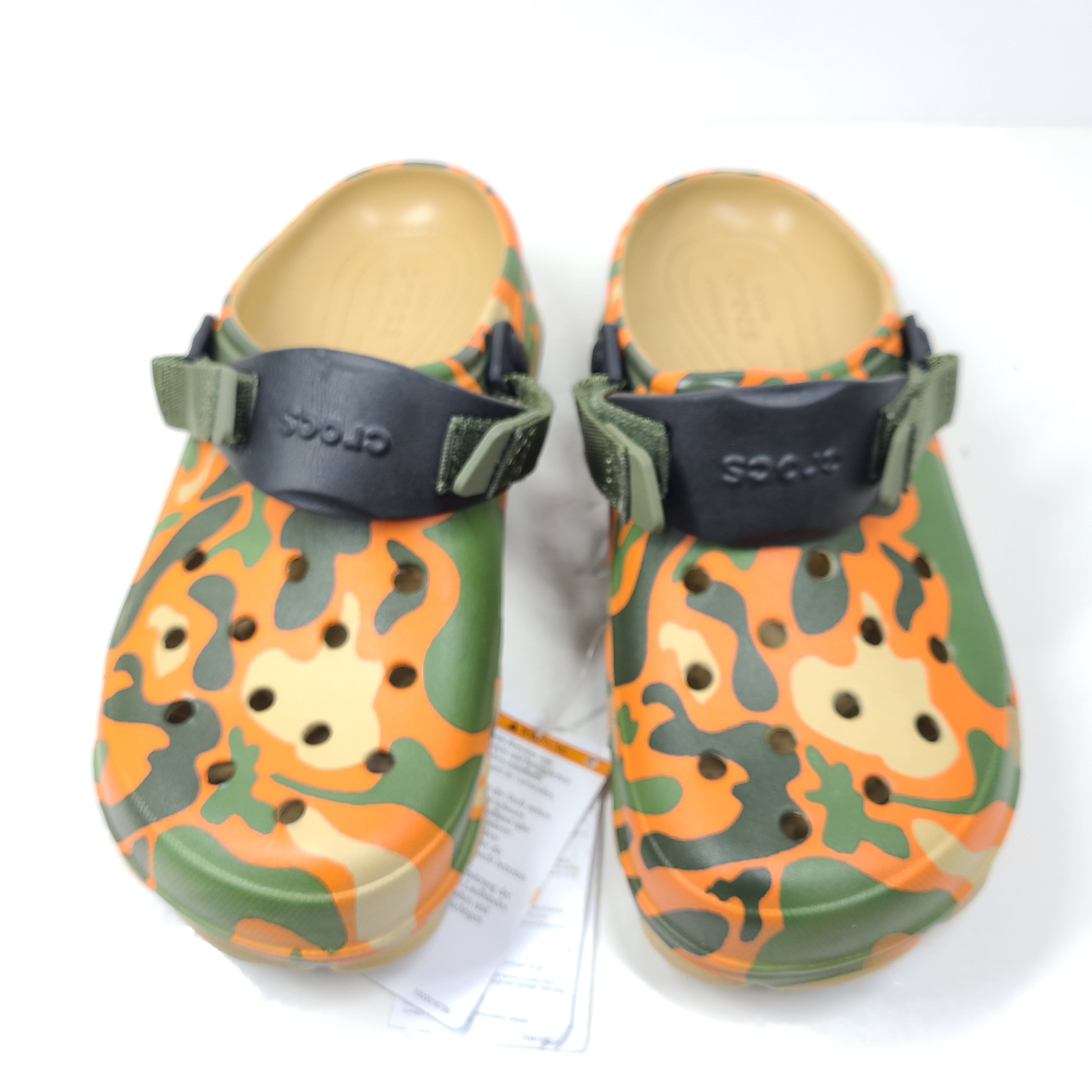 A pair of camouflage Crocs Classic clogs for men and women.
