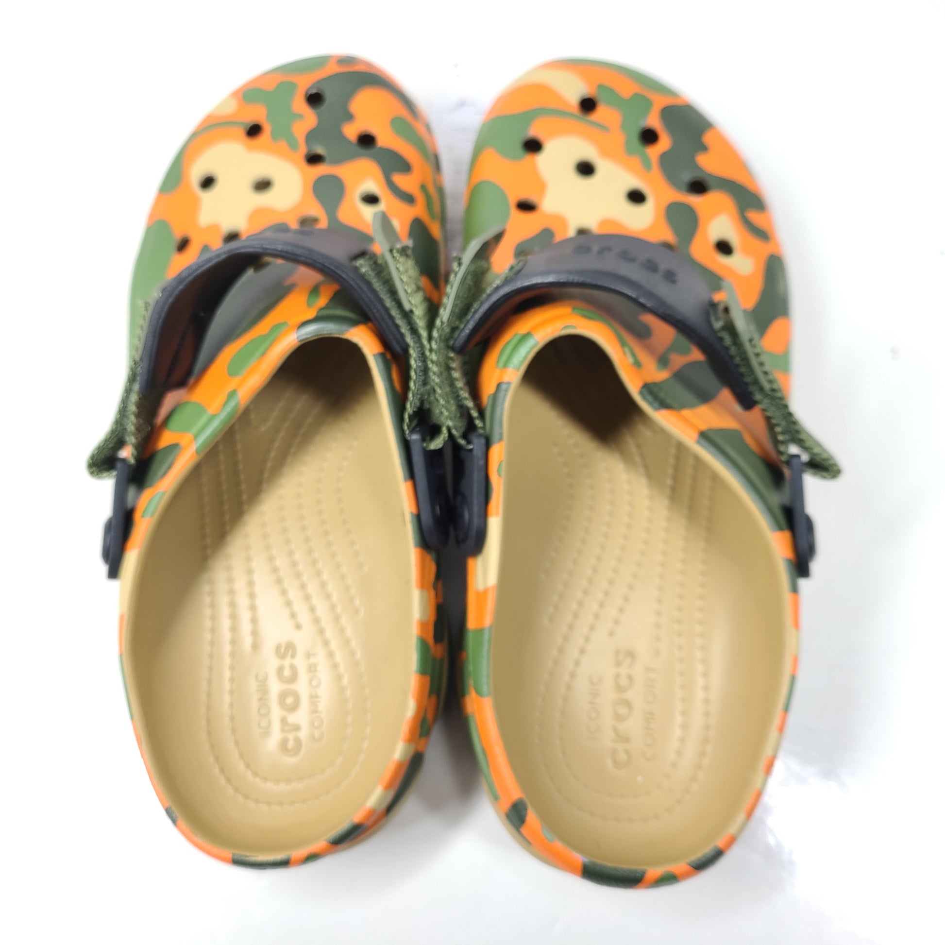 A pair of camouflage Crocs Classic clogs for men and women.