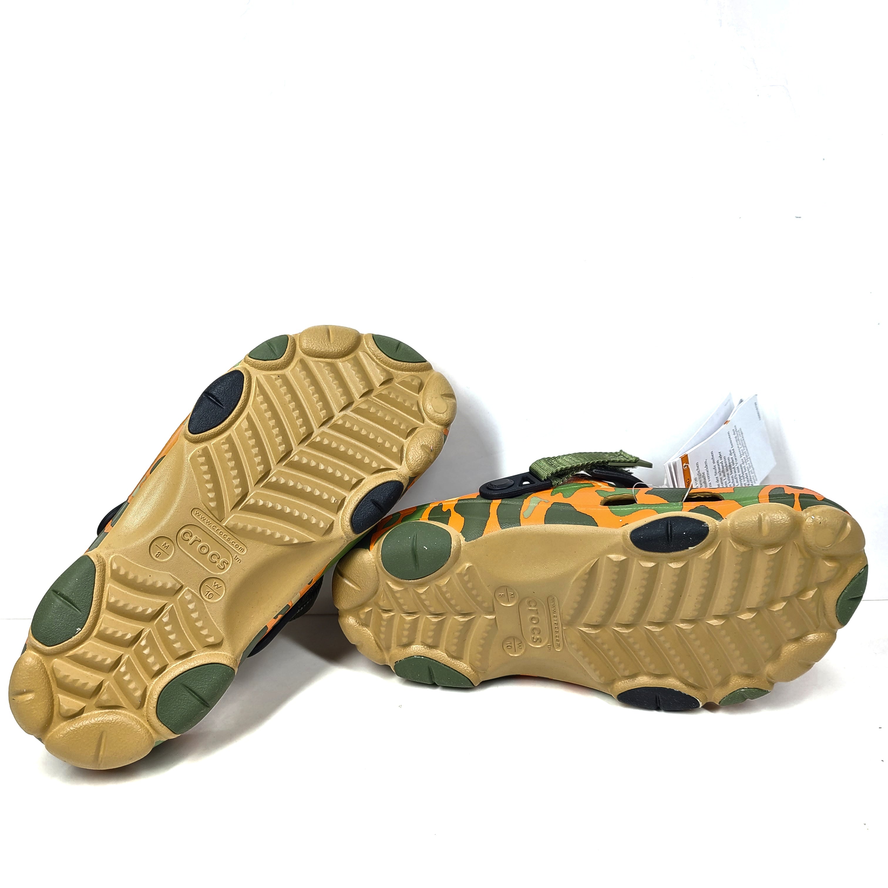 A pair of camouflage Crocs Classic clogs for men and women.