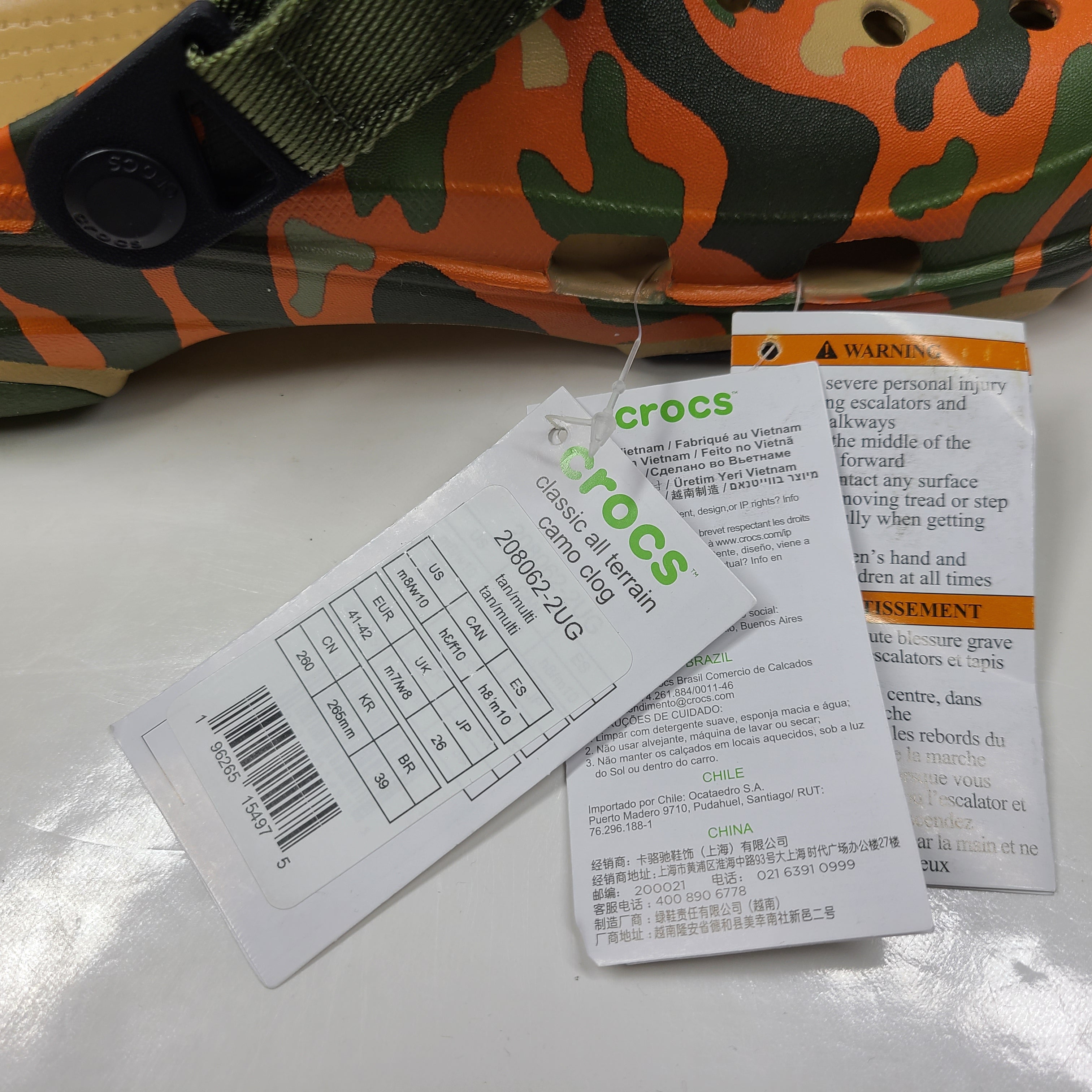 A pair of camouflage Crocs Classic clogs for men and women.