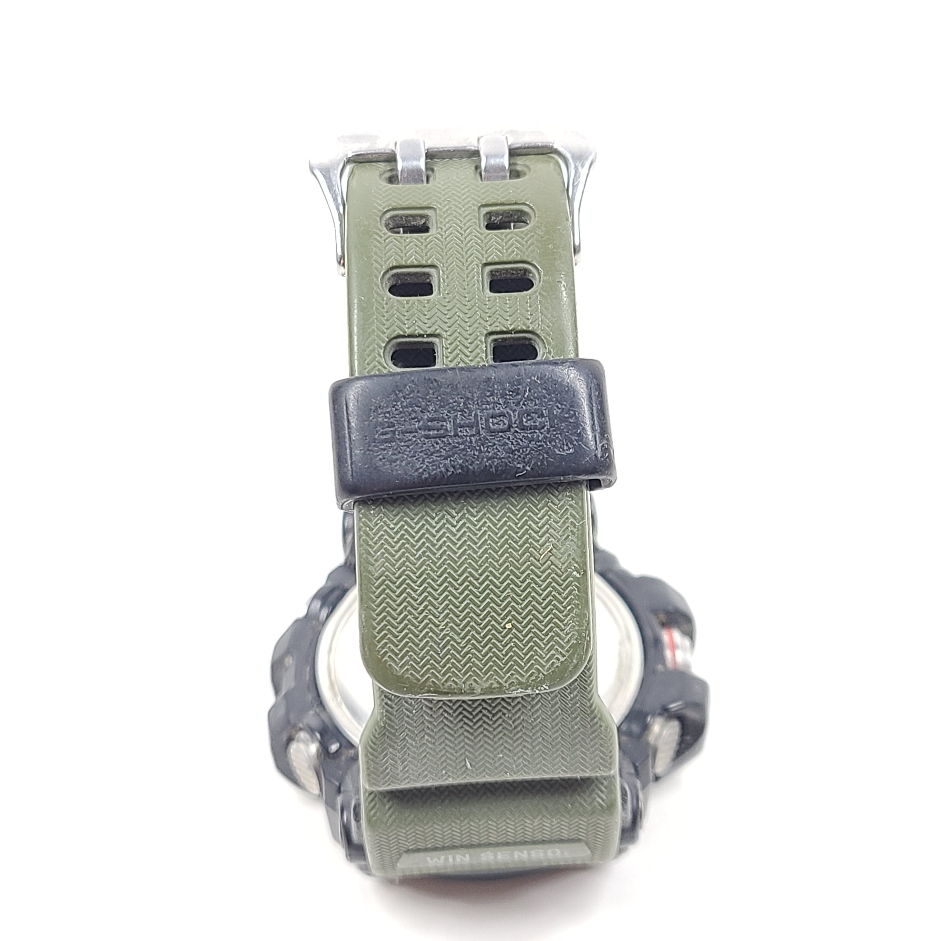 A military green Casio G-Shock watch on a strap.