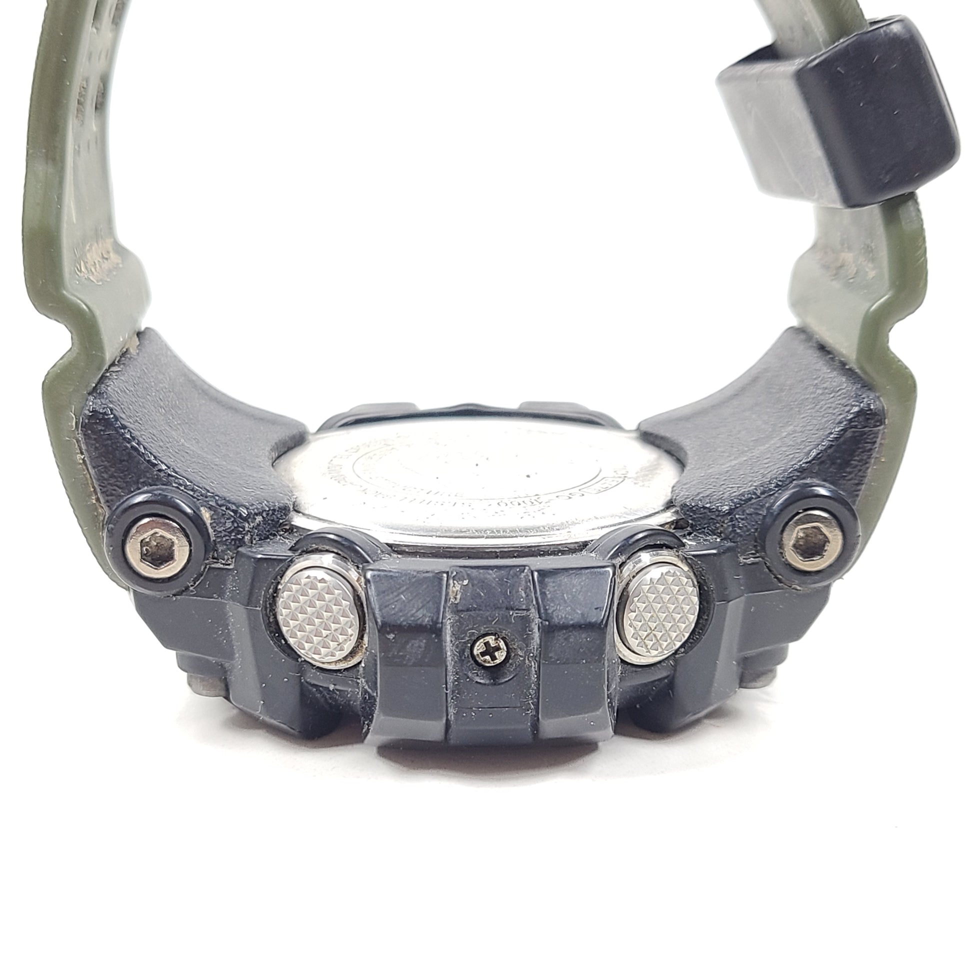 A military green Casio G-Shock watch on a strap.