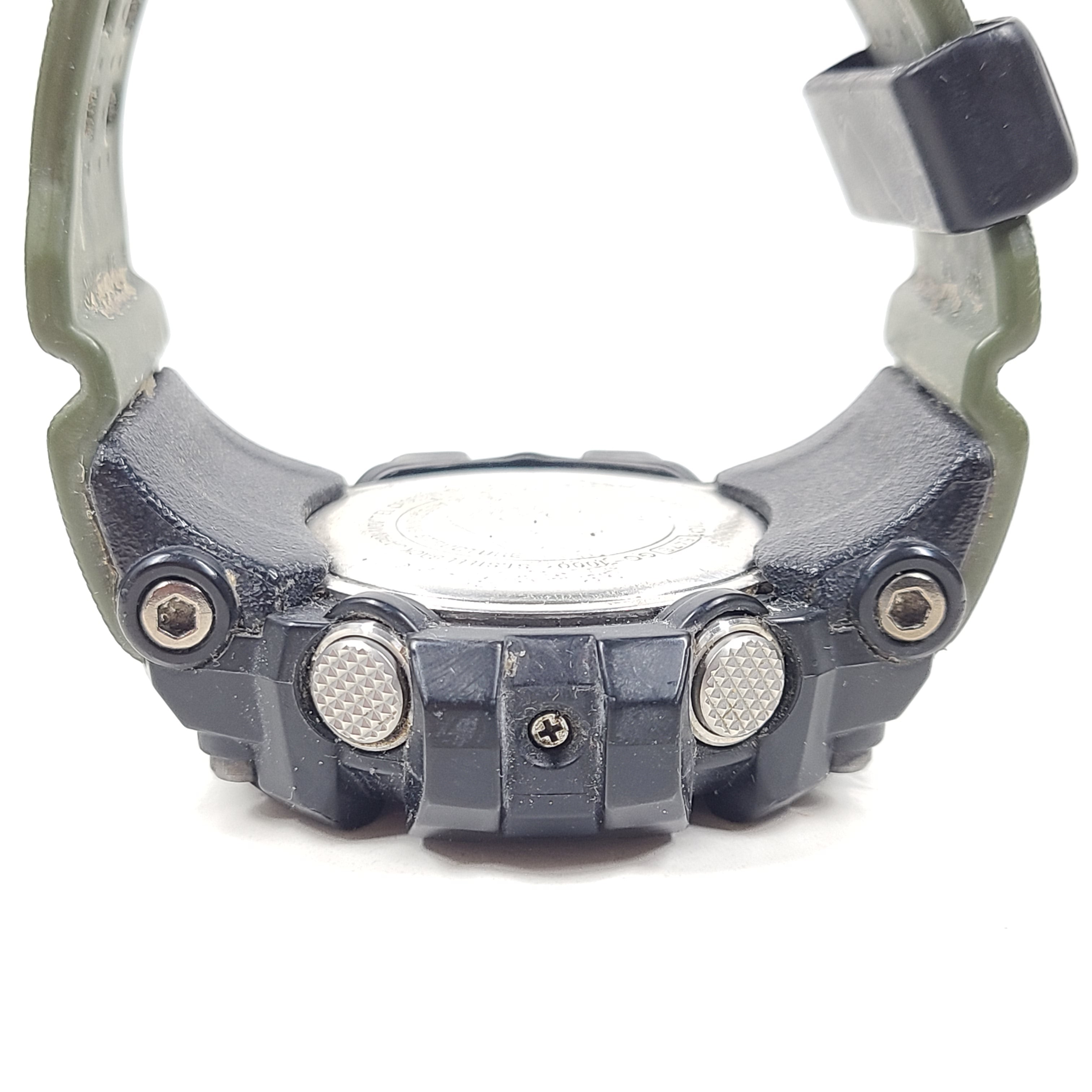 A military green Casio G-Shock watch on a strap.
