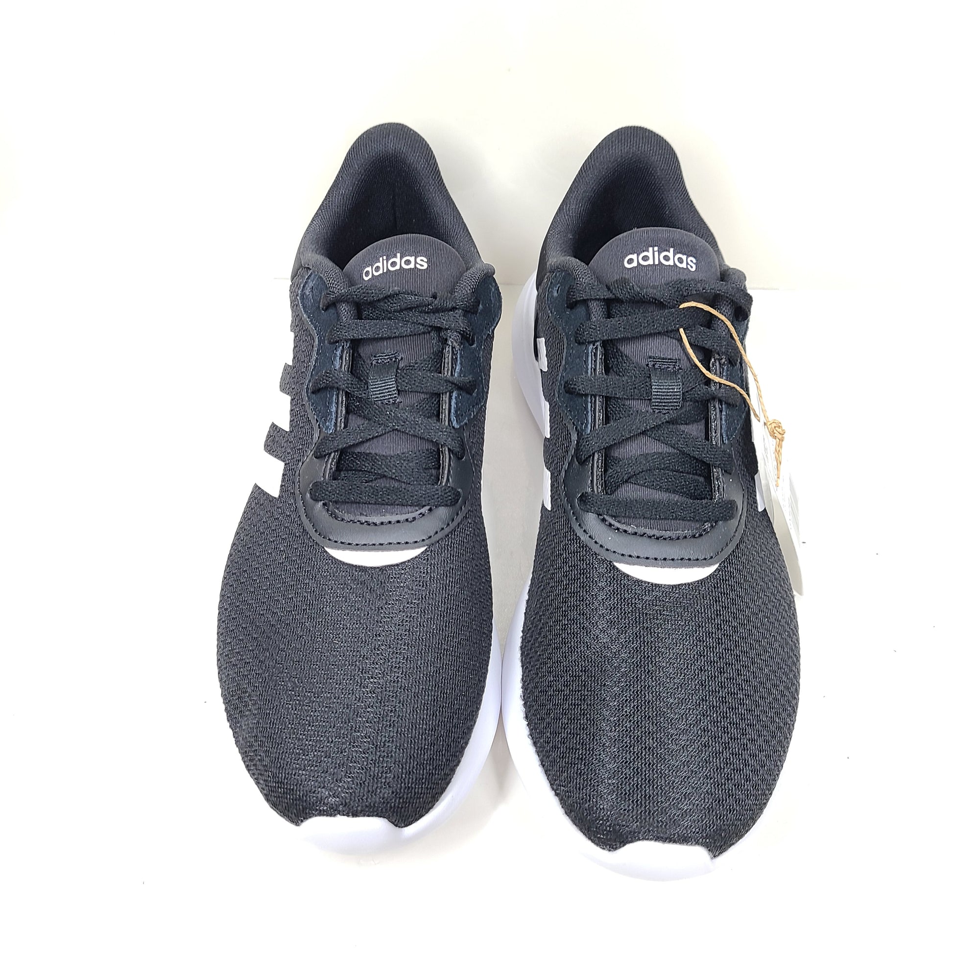 A pair of women's Adidas QT Racer 3.0 running shoes in size 7.5 with cloudfoam sole and END PLASTIC WASTE detail.