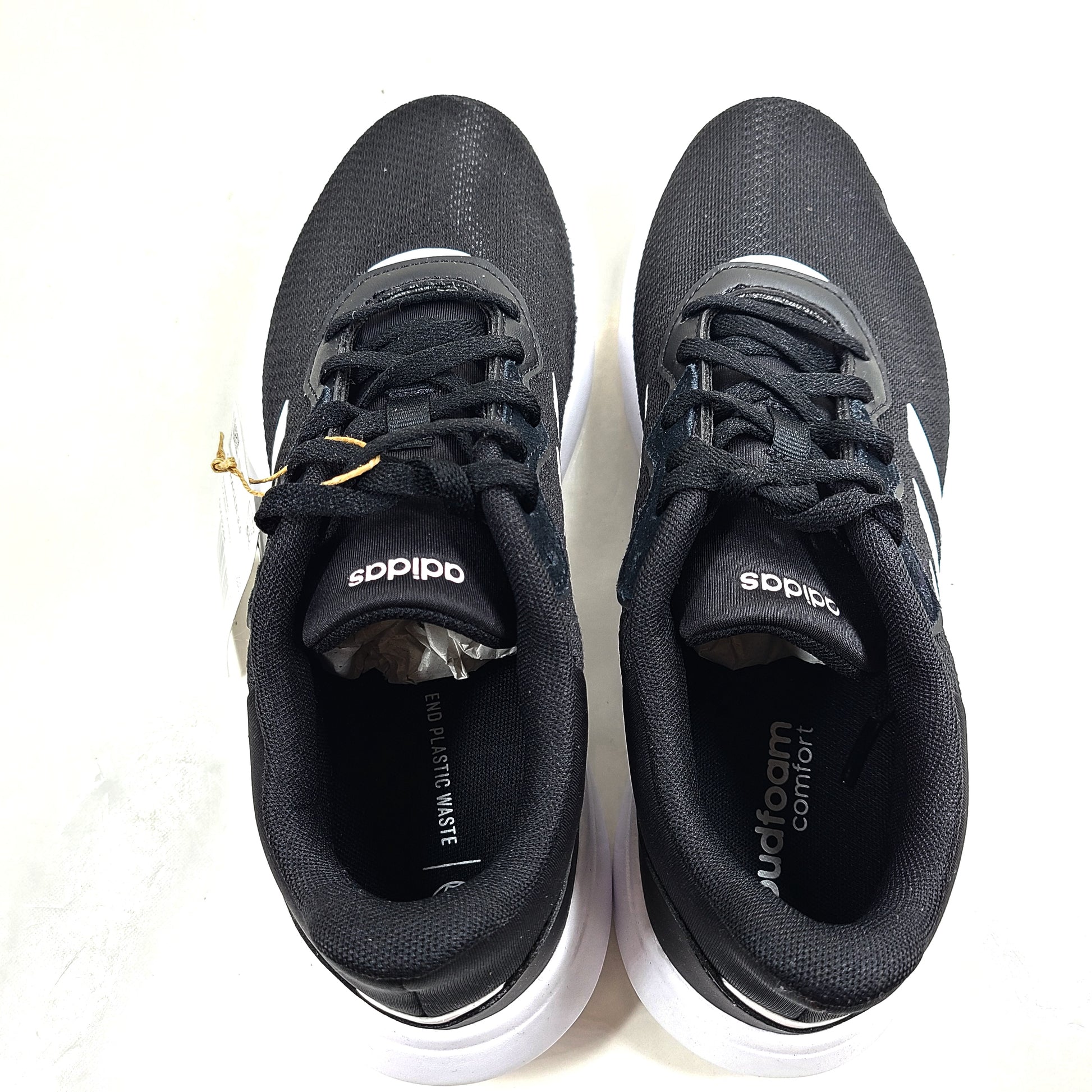A pair of women's Adidas QT Racer 3.0 running shoes in size 7.5 with cloudfoam sole and END PLASTIC WASTE detail.
