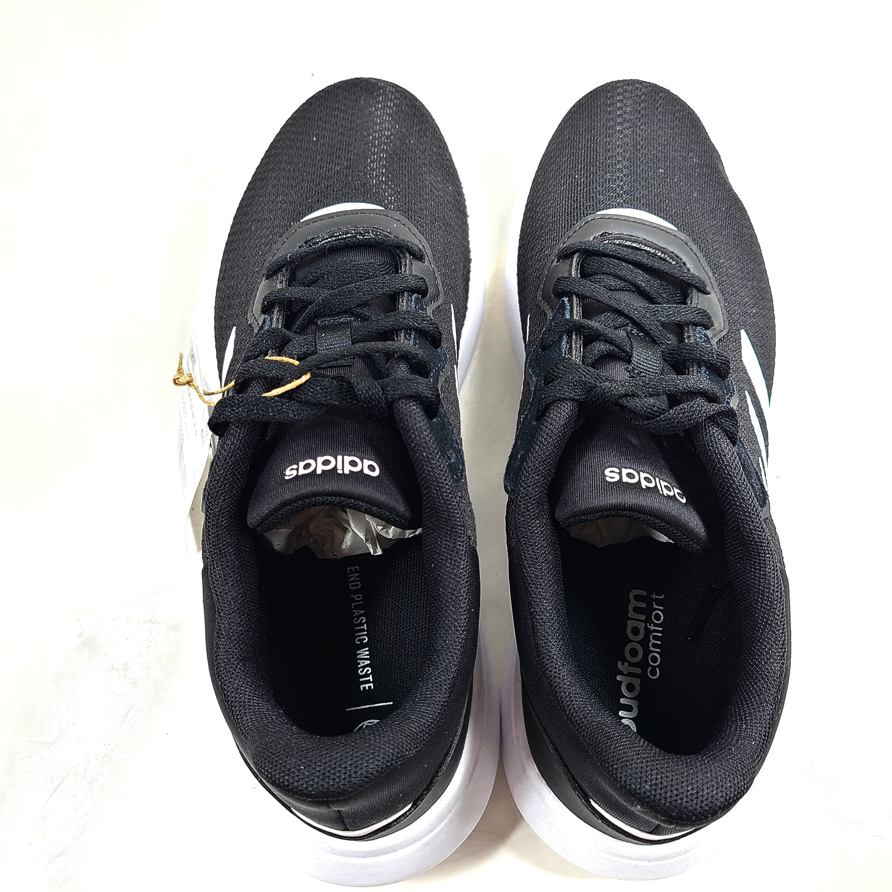 A pair of women's Adidas QT Racer 3.0 running shoes in size 7.5 with cloudfoam sole and END PLASTIC WASTE detail.