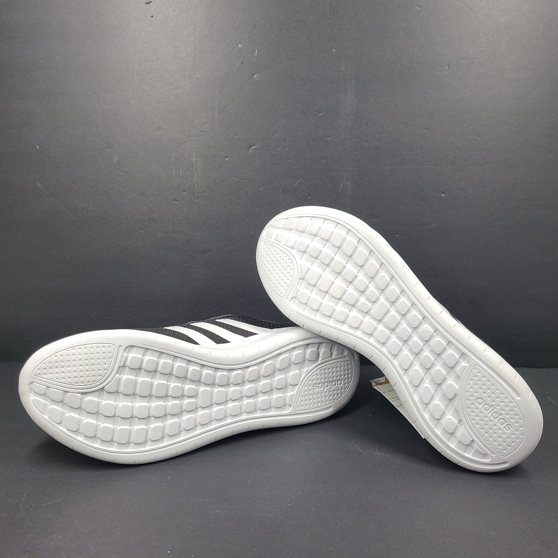 A pair of women's Adidas QT Racer 3.0 running shoes in size 7.5 with cloudfoam sole and END PLASTIC WASTE detail.
