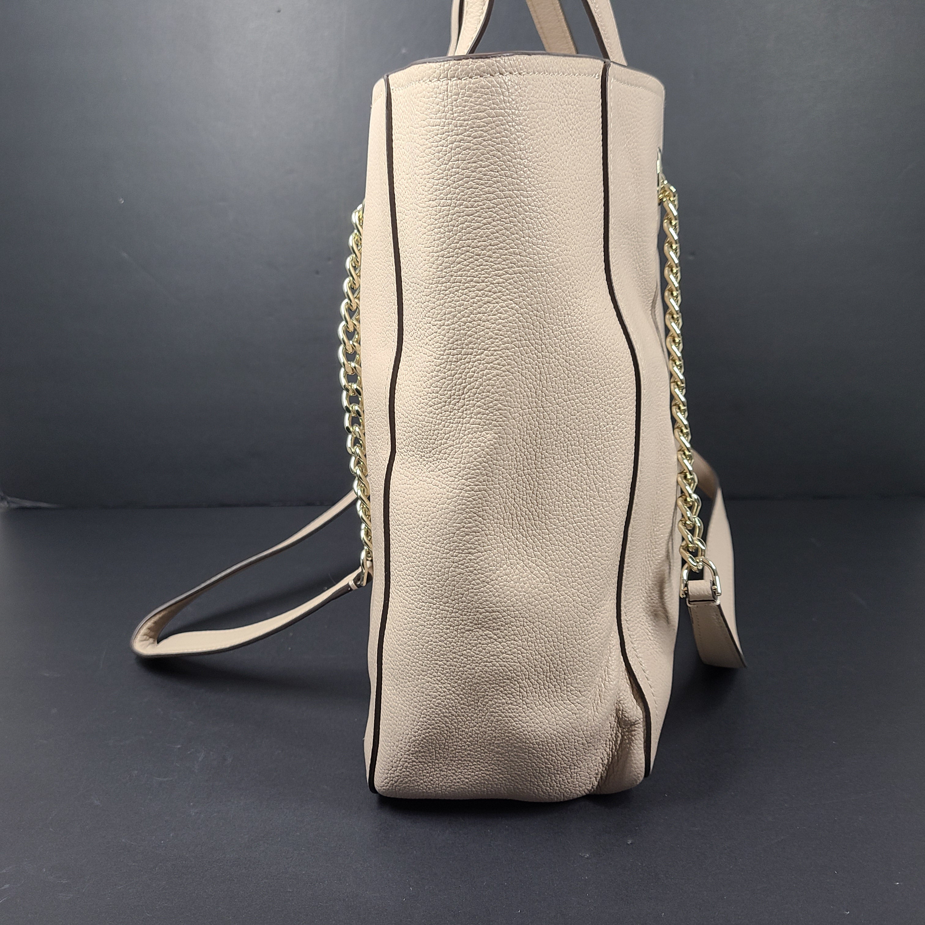 Beige Kate Spade leather tote with chain handles and gold hardware